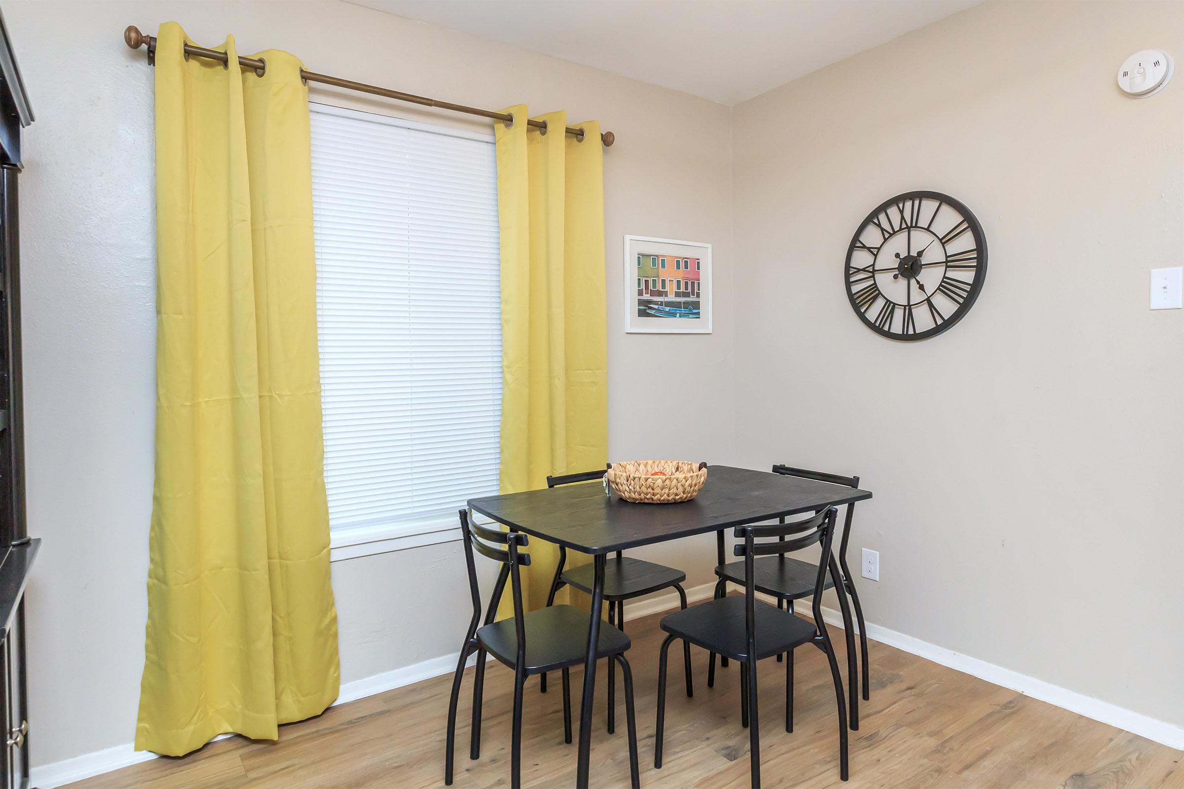 Dining room with yellow curtains