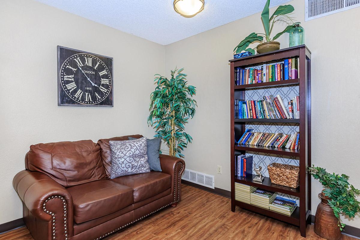 a brown leather couch in a living room