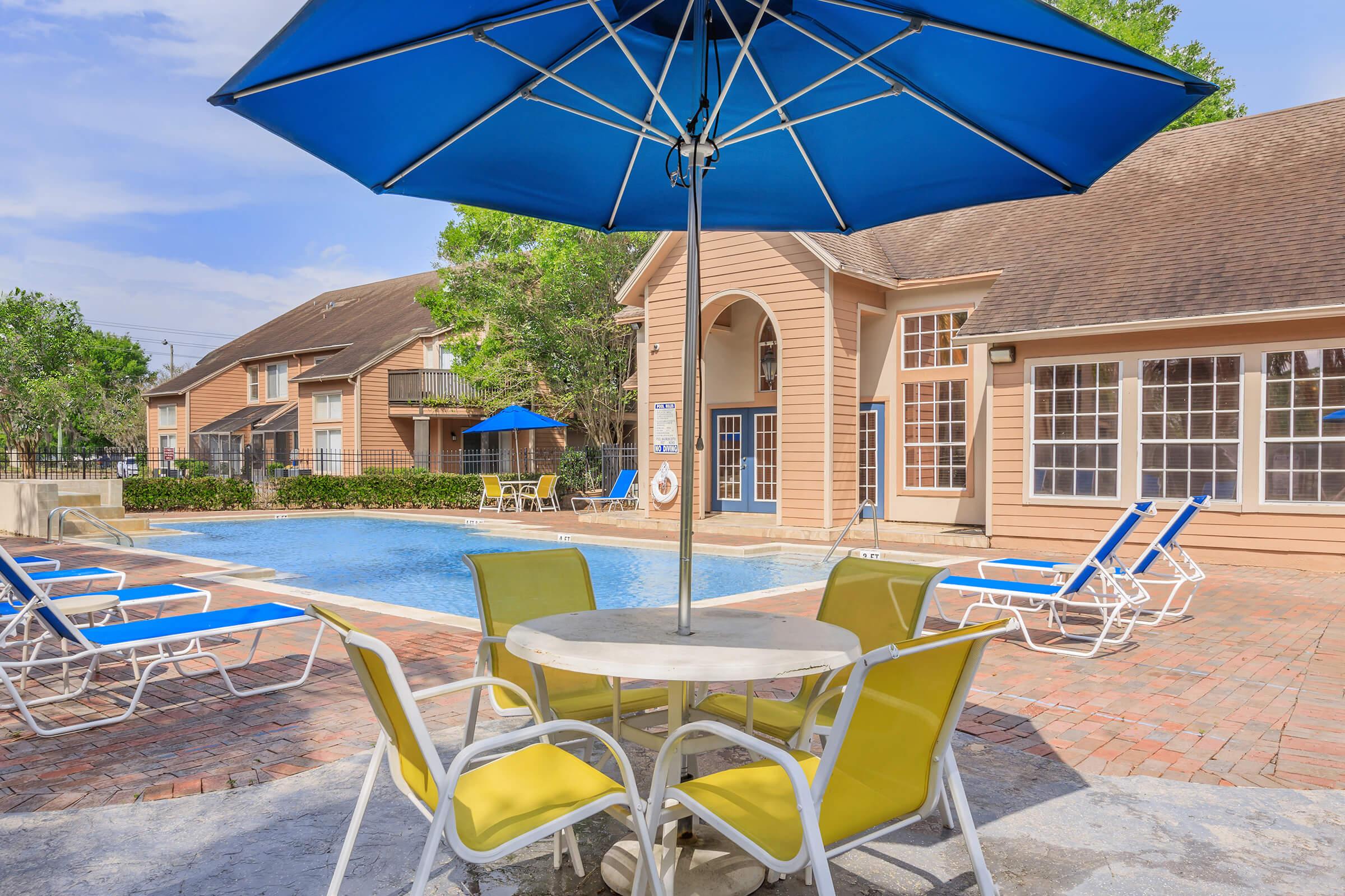 a lawn chair under an umbrella