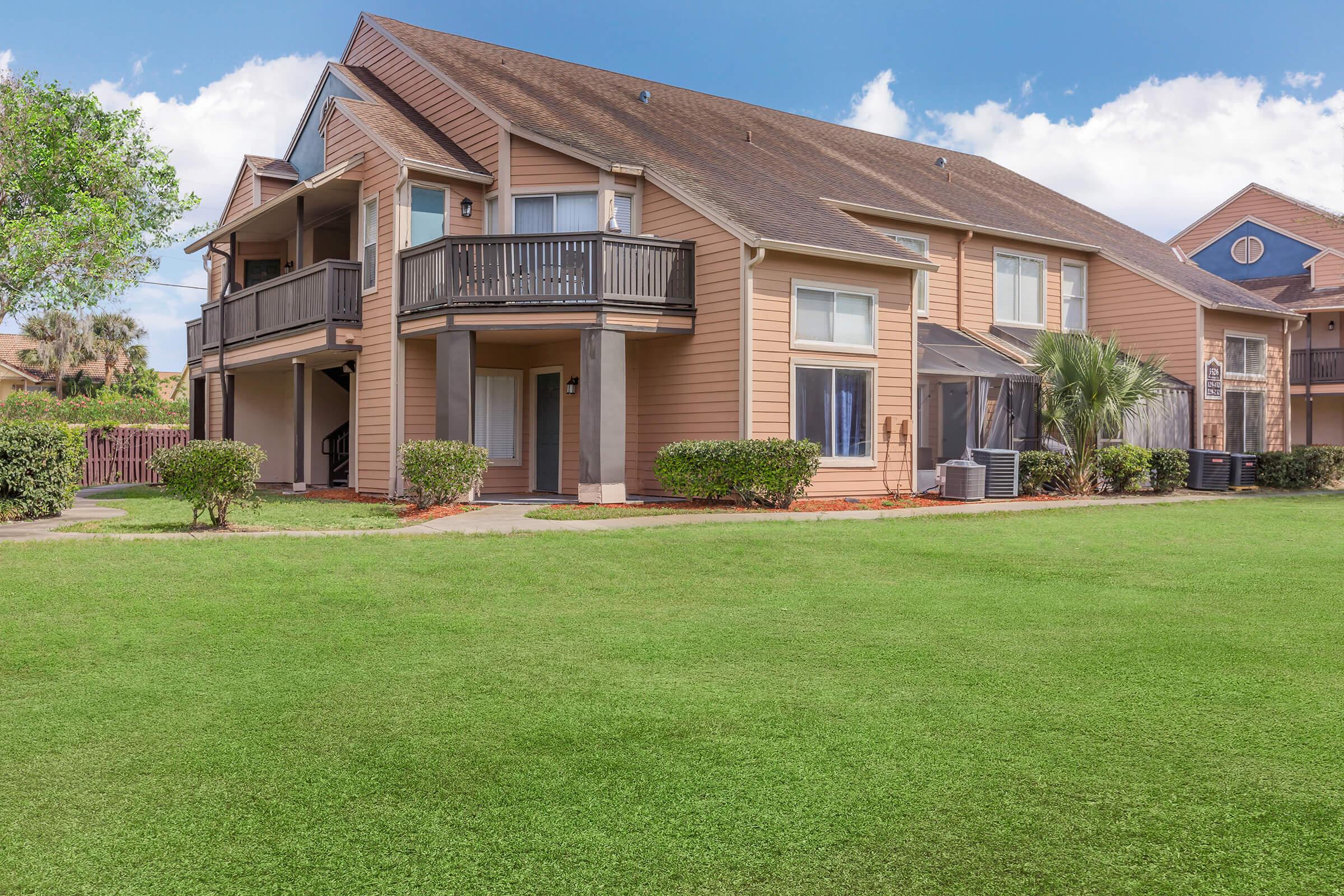 a large lawn in front of a house