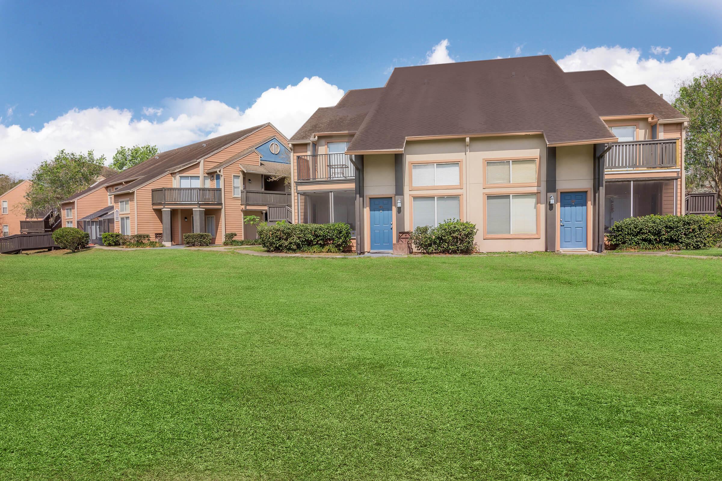 a large lawn in front of a house