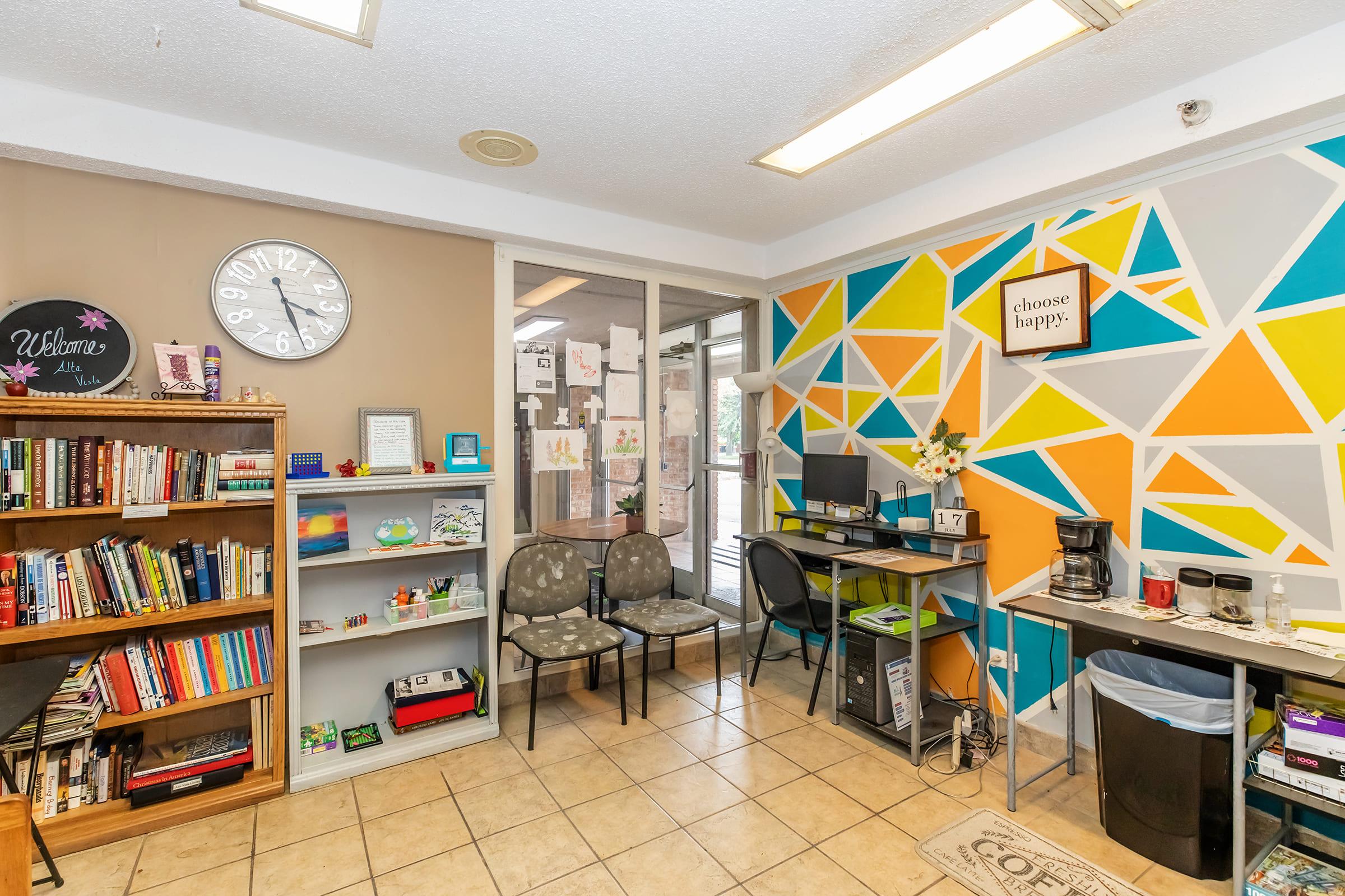 a room filled with furniture and a book shelf