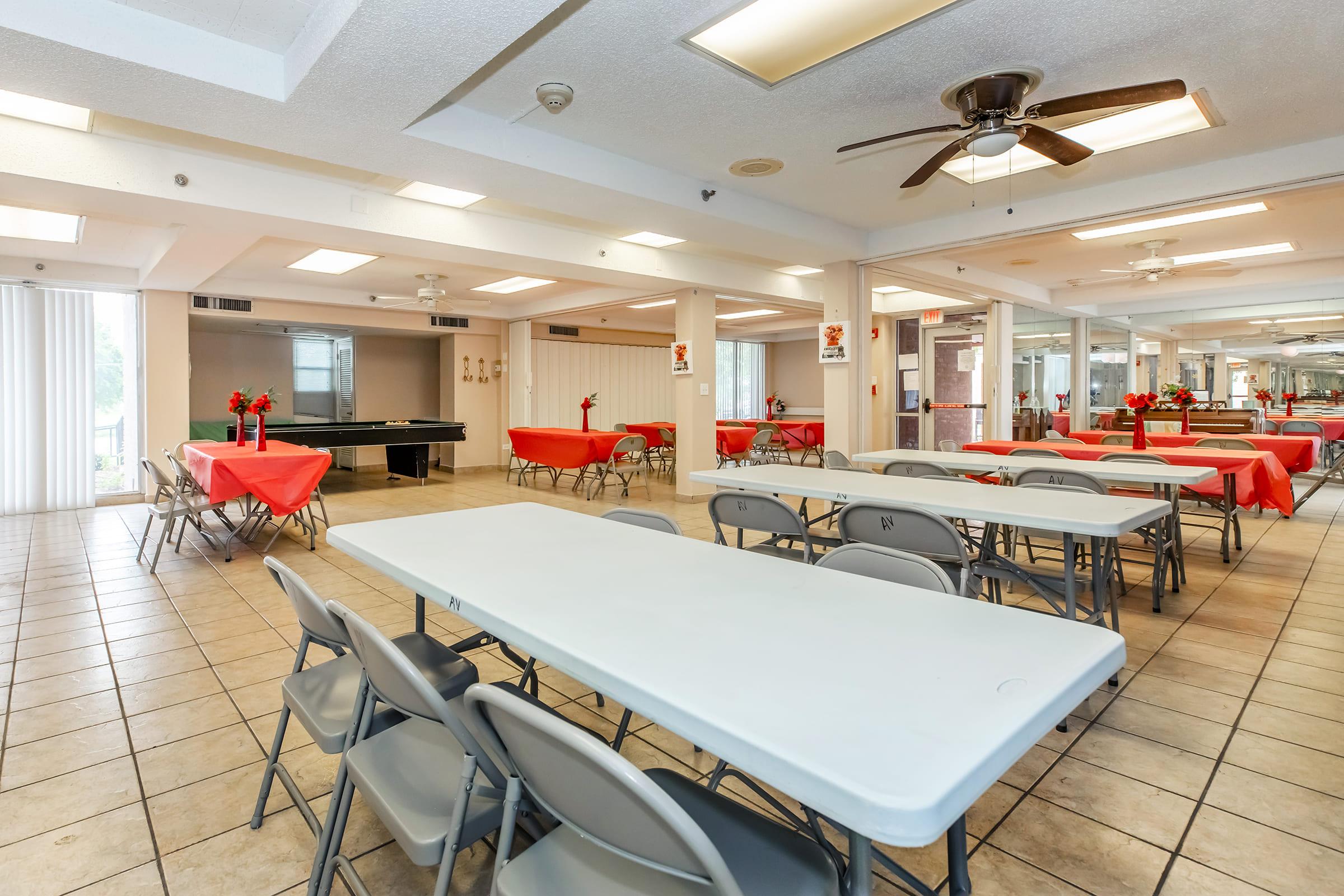 a large room with tables and chairs