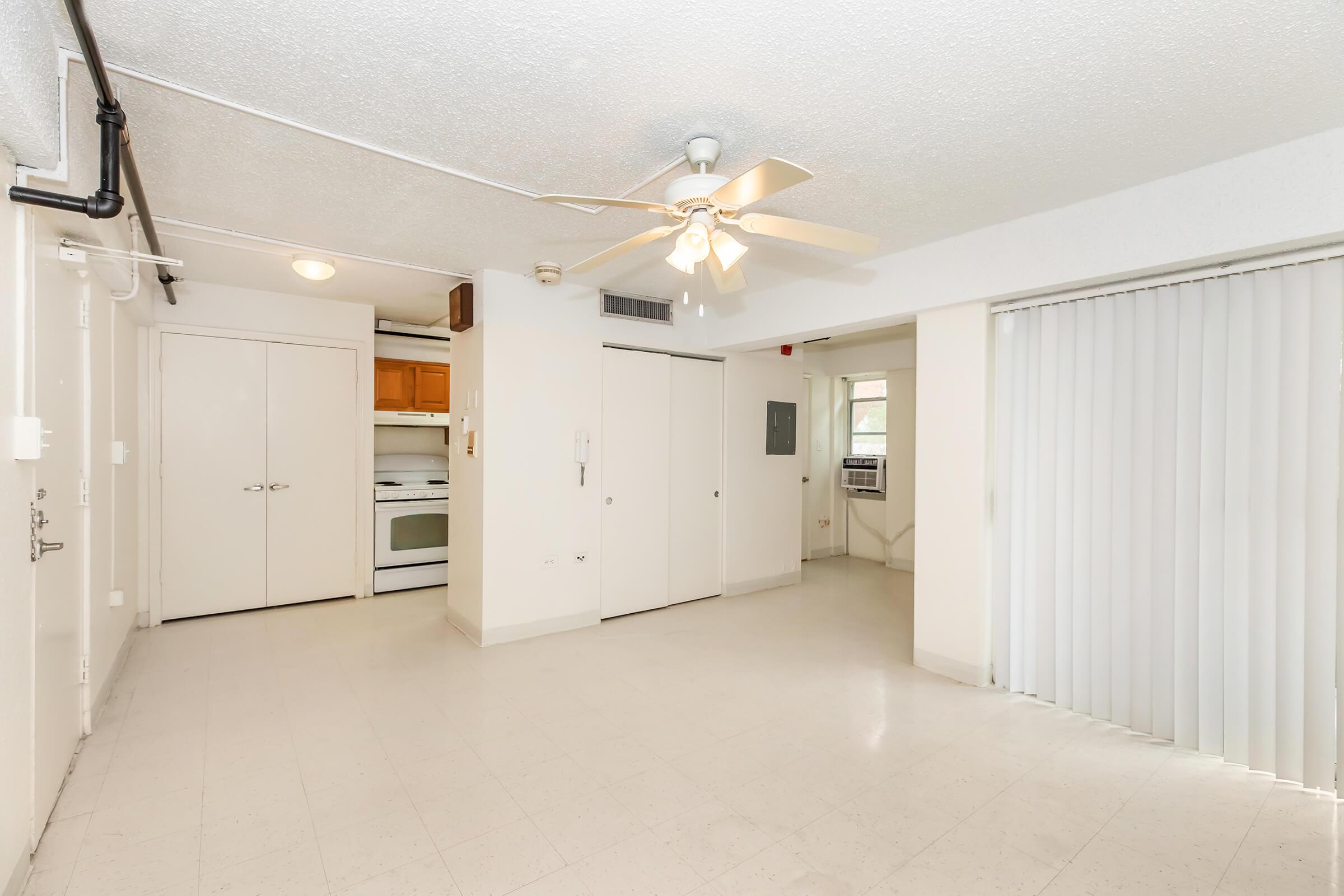 a kitchen area with a building in the background