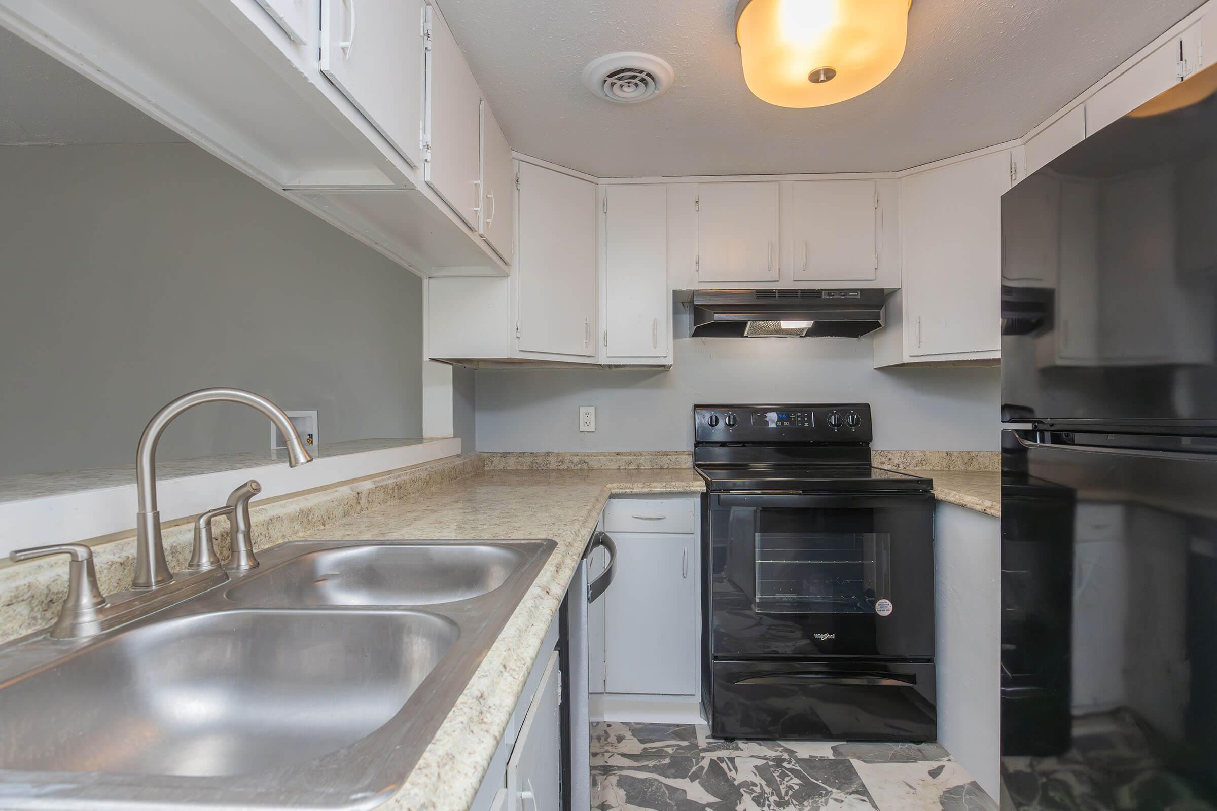 a large kitchen with stainless steel appliances