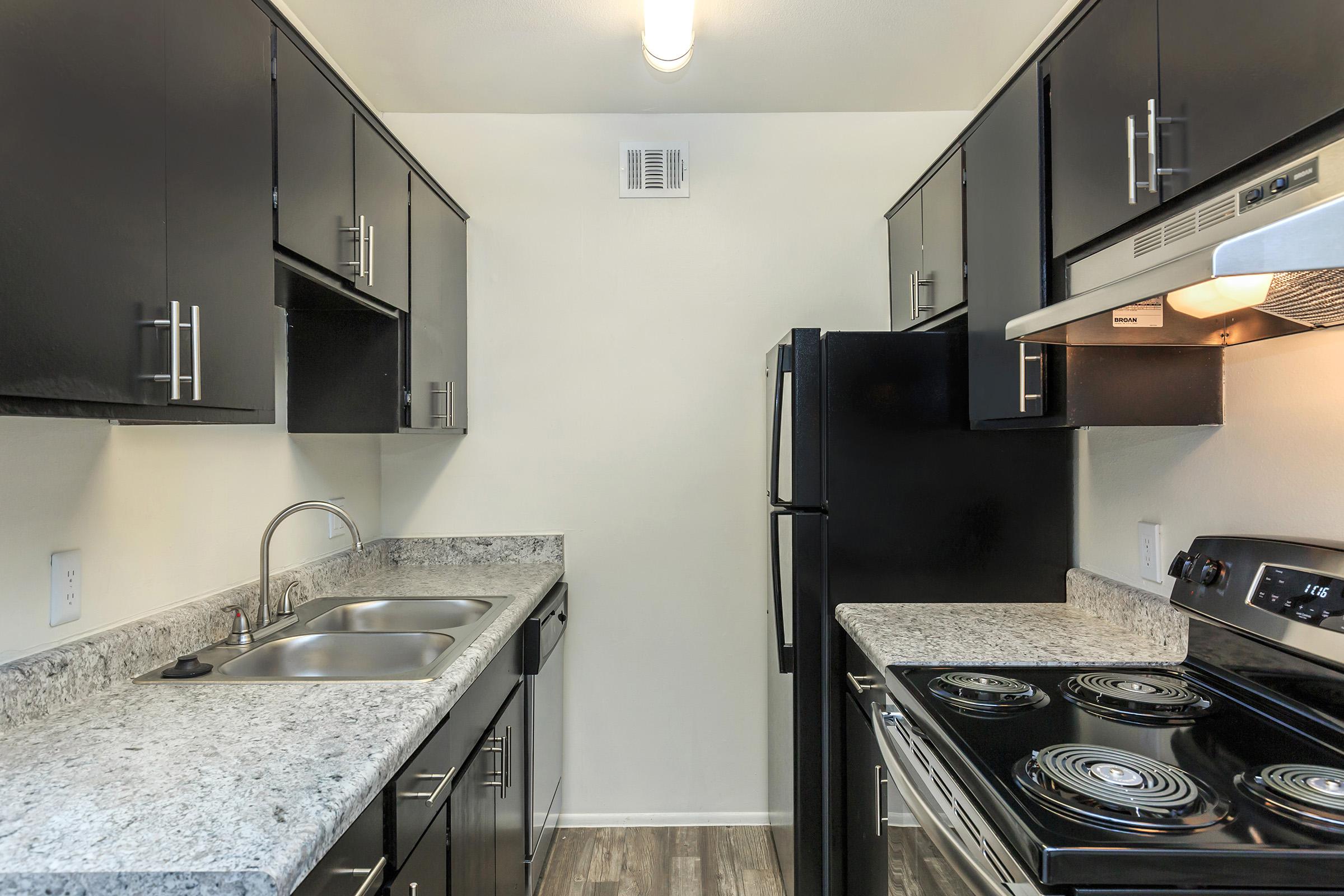 A FULLY EQUIPPED KITCHEN WITH DISHWASHER