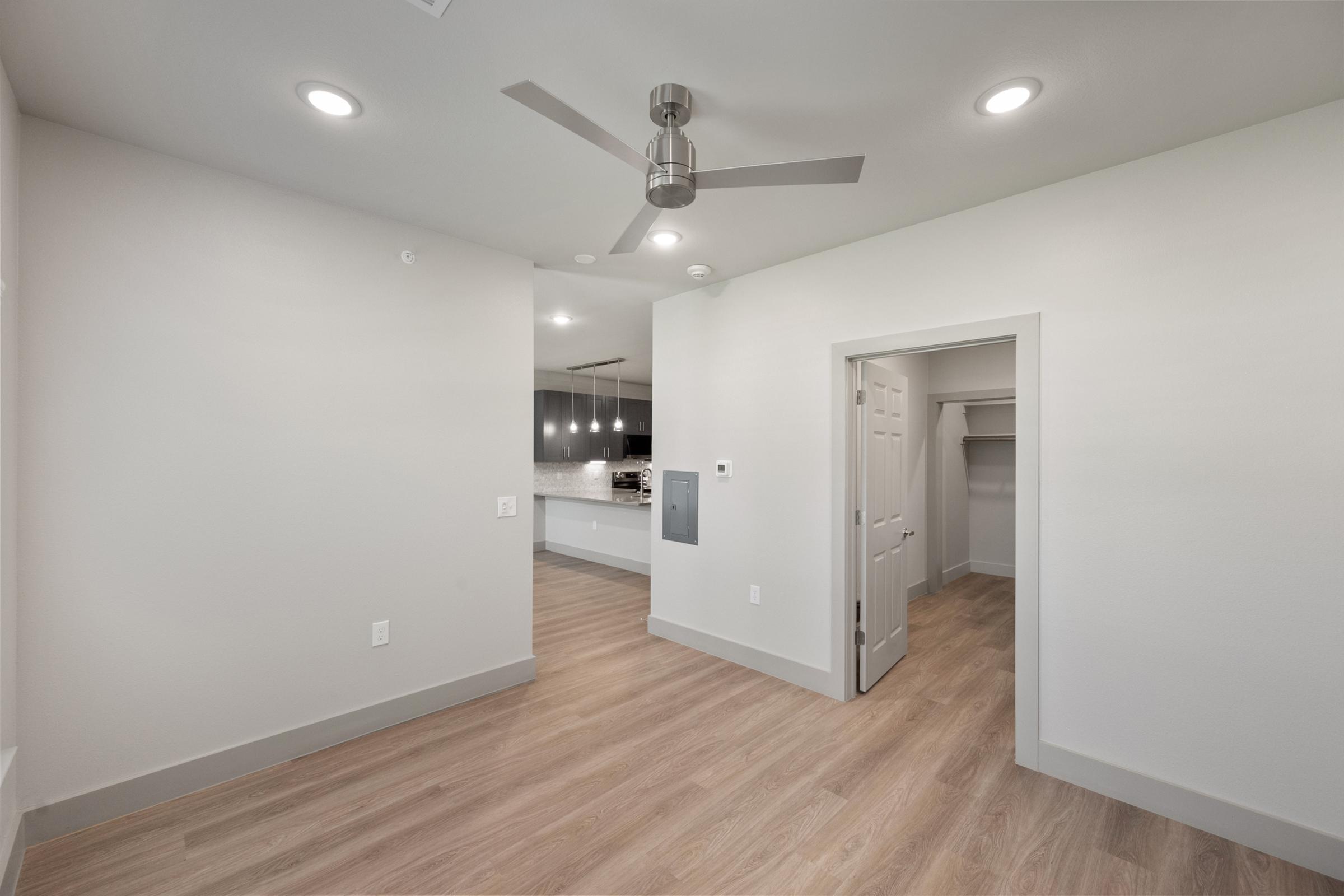 Comfortable bedroom in the A1 unit with soft carpeting and direct access to the bathroom and walk-in closet.