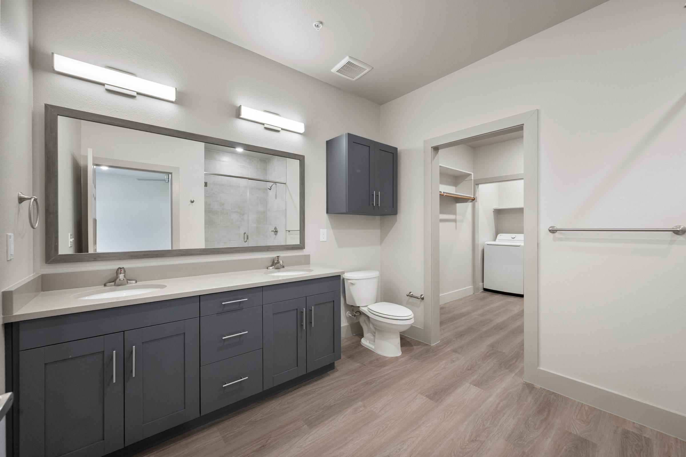 Bathroom in the A2 Floor Plan featuring a modern walk-in shower, sleek vanity, and contemporary fixtures for a clean, spacious feel.