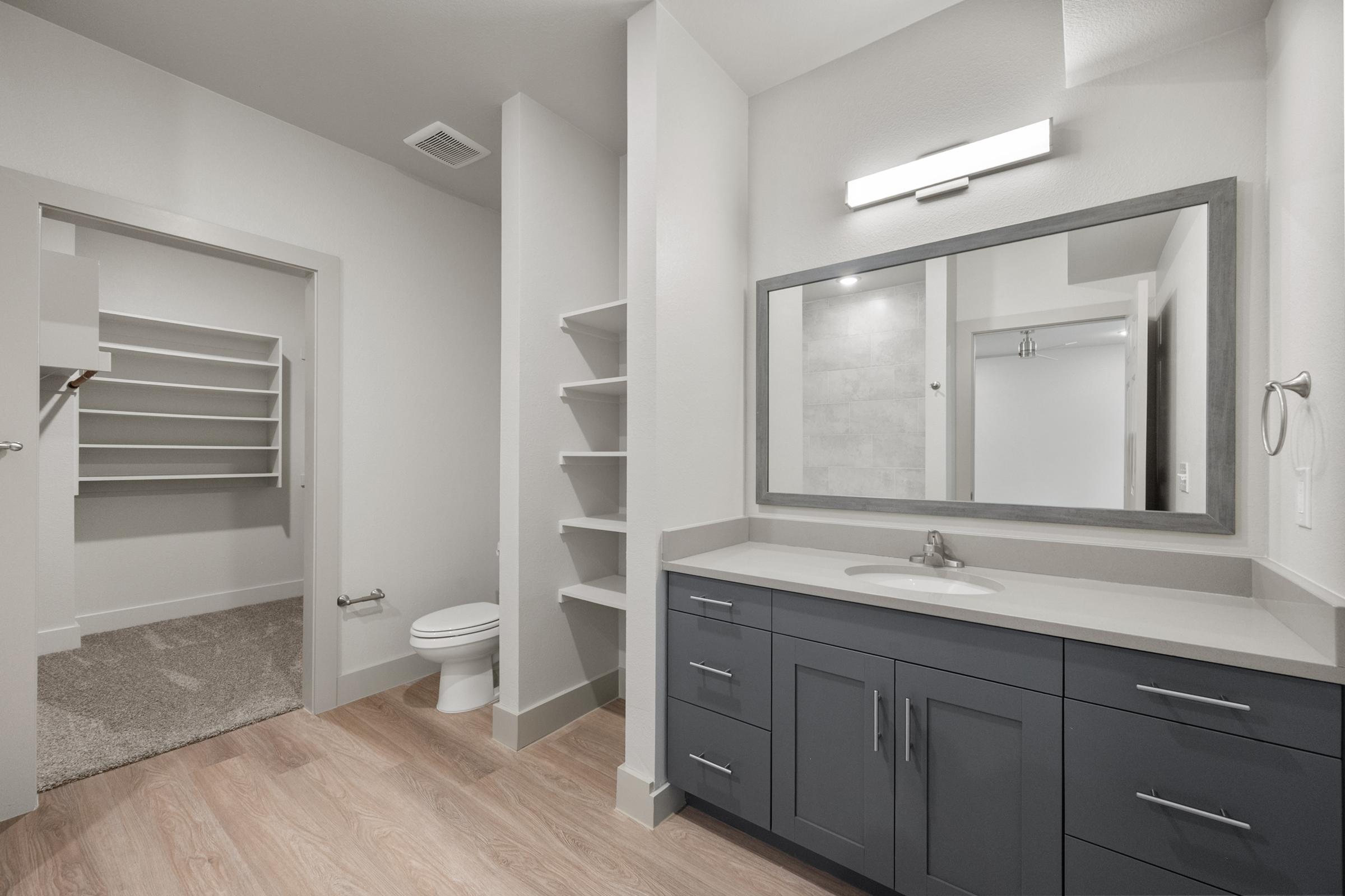 Bathroom with shower-tub combination and contemporary fixtures in the A3 Floor Plan at The Emma Apartments.