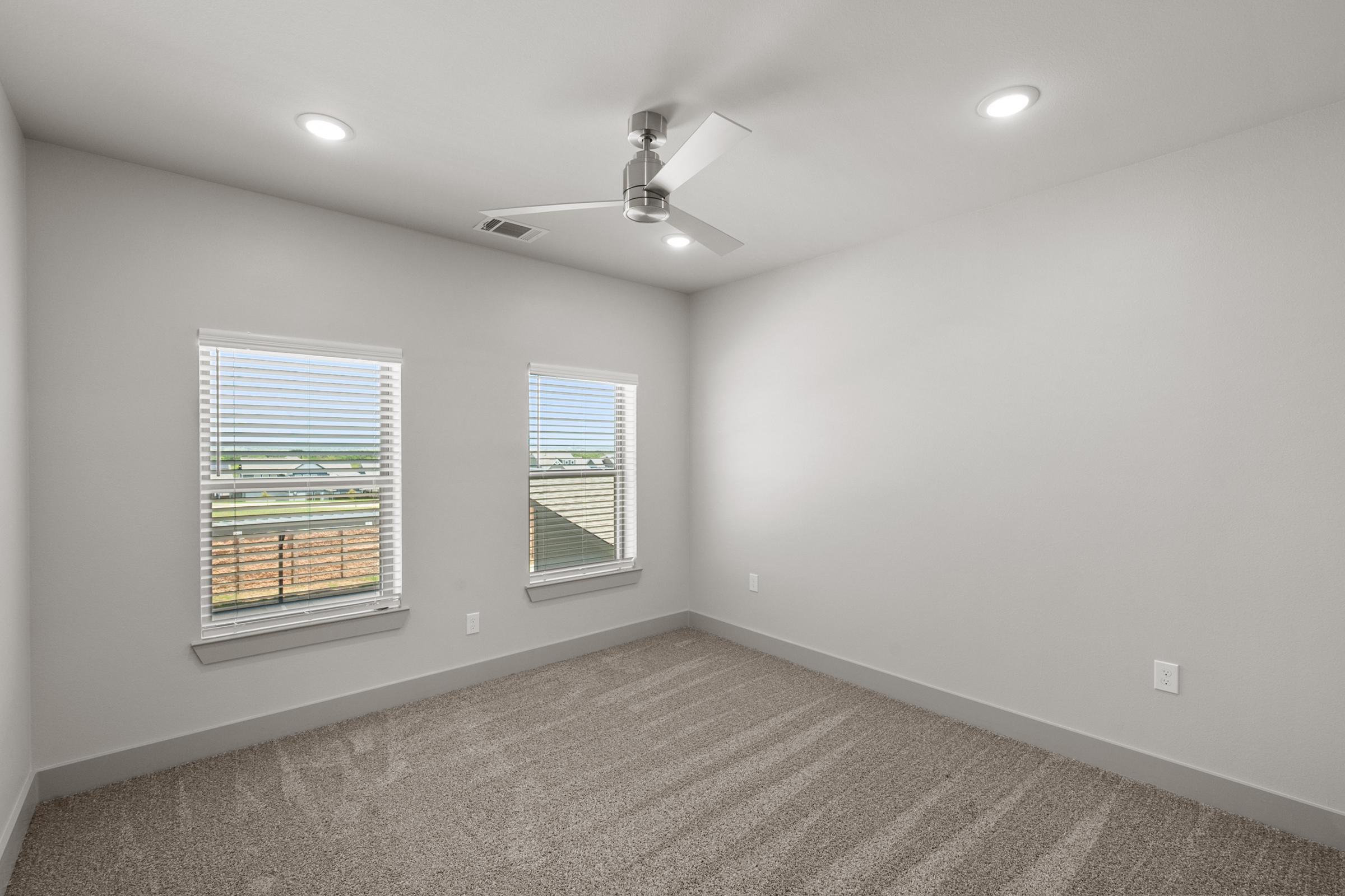 Spacious one-bedroom layout in the A4 unit with plush carpeting, ample natural light, and a large walk-in closet.