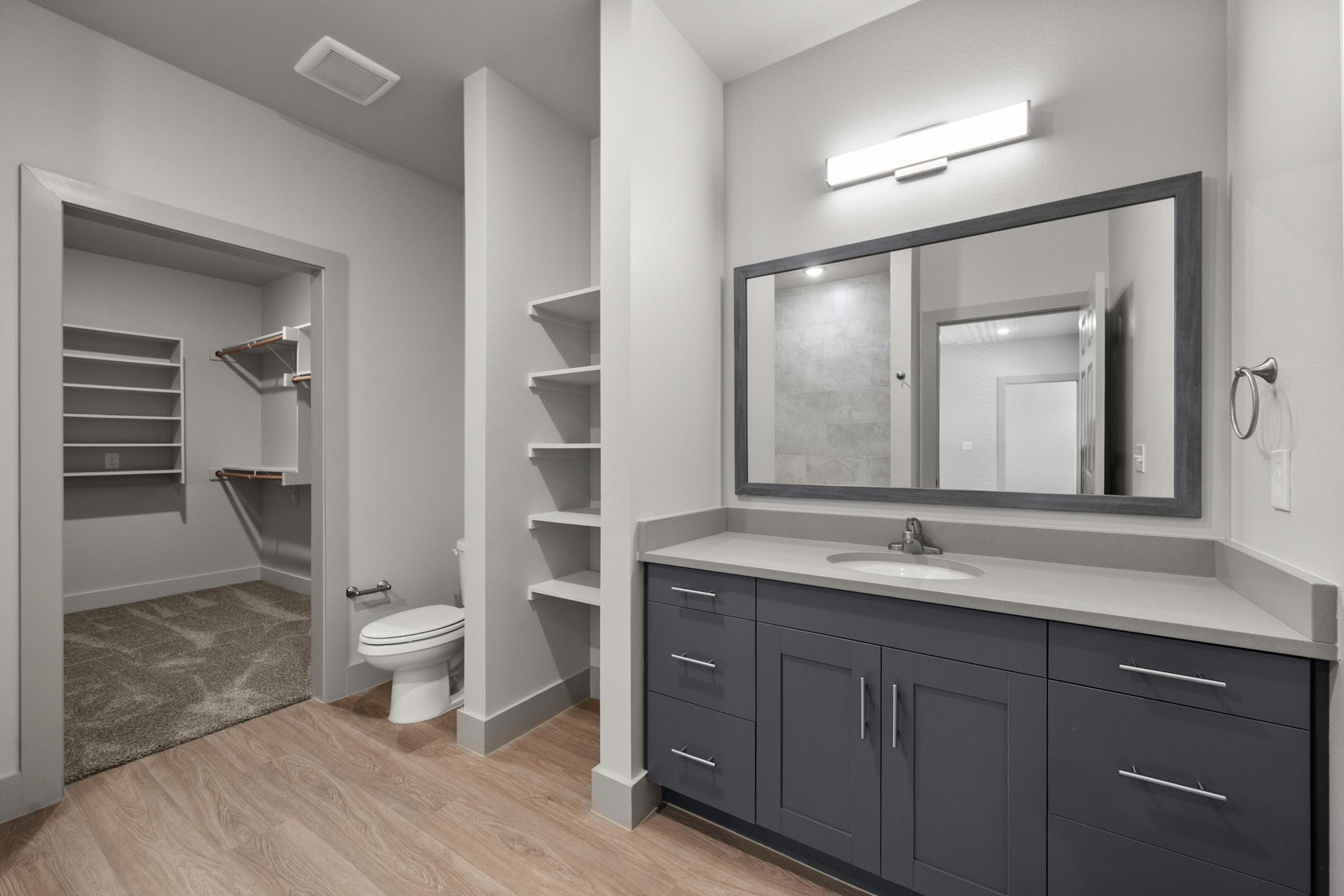 Full secondary bathroom with a shower-tub combination, modern finishes, and convenient location near the second bedroom.