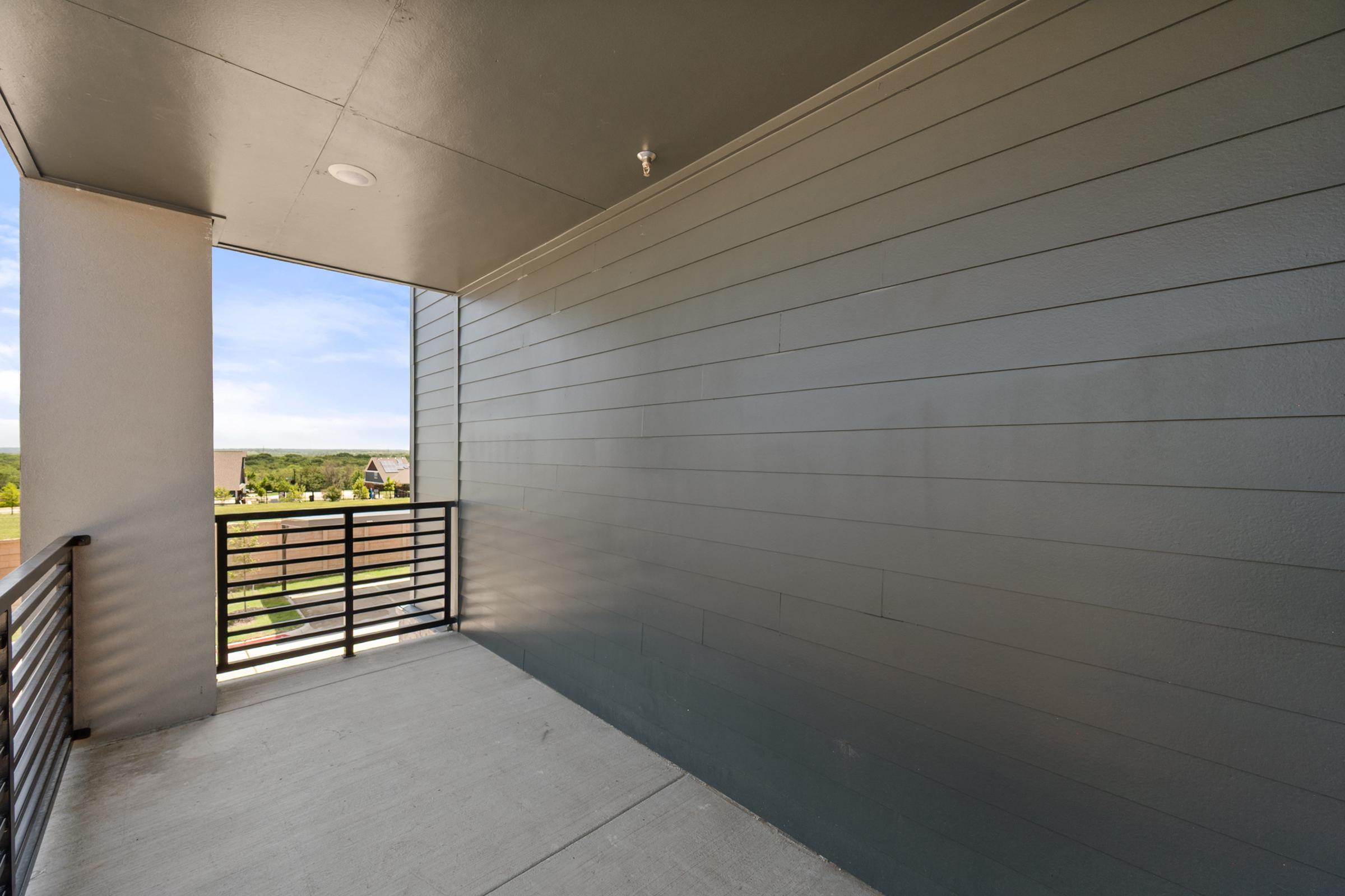Private patio or balcony in the C1 unit offering outdoor space for relaxing, dining, or enjoying fresh air.