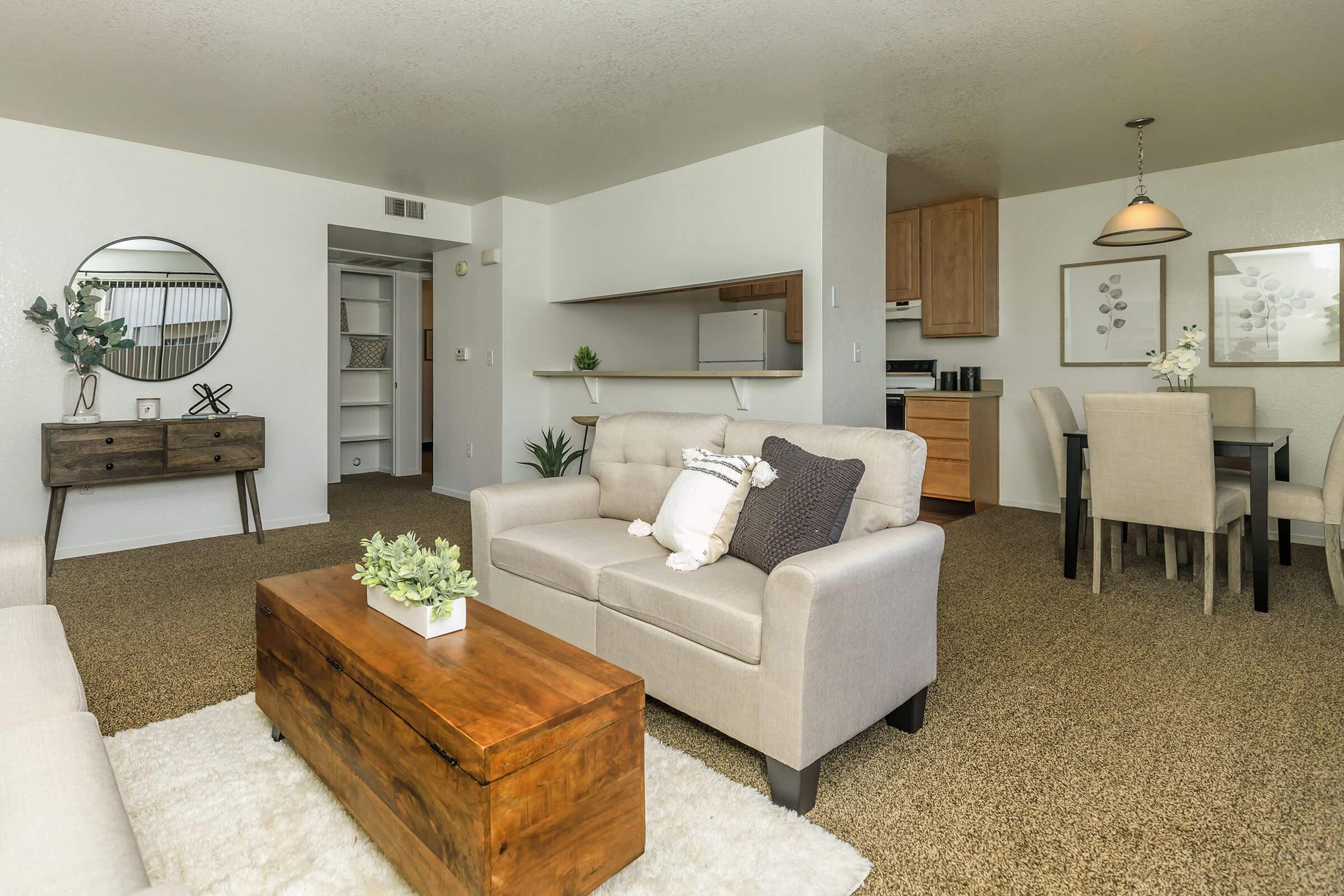 a living room filled with furniture and a table