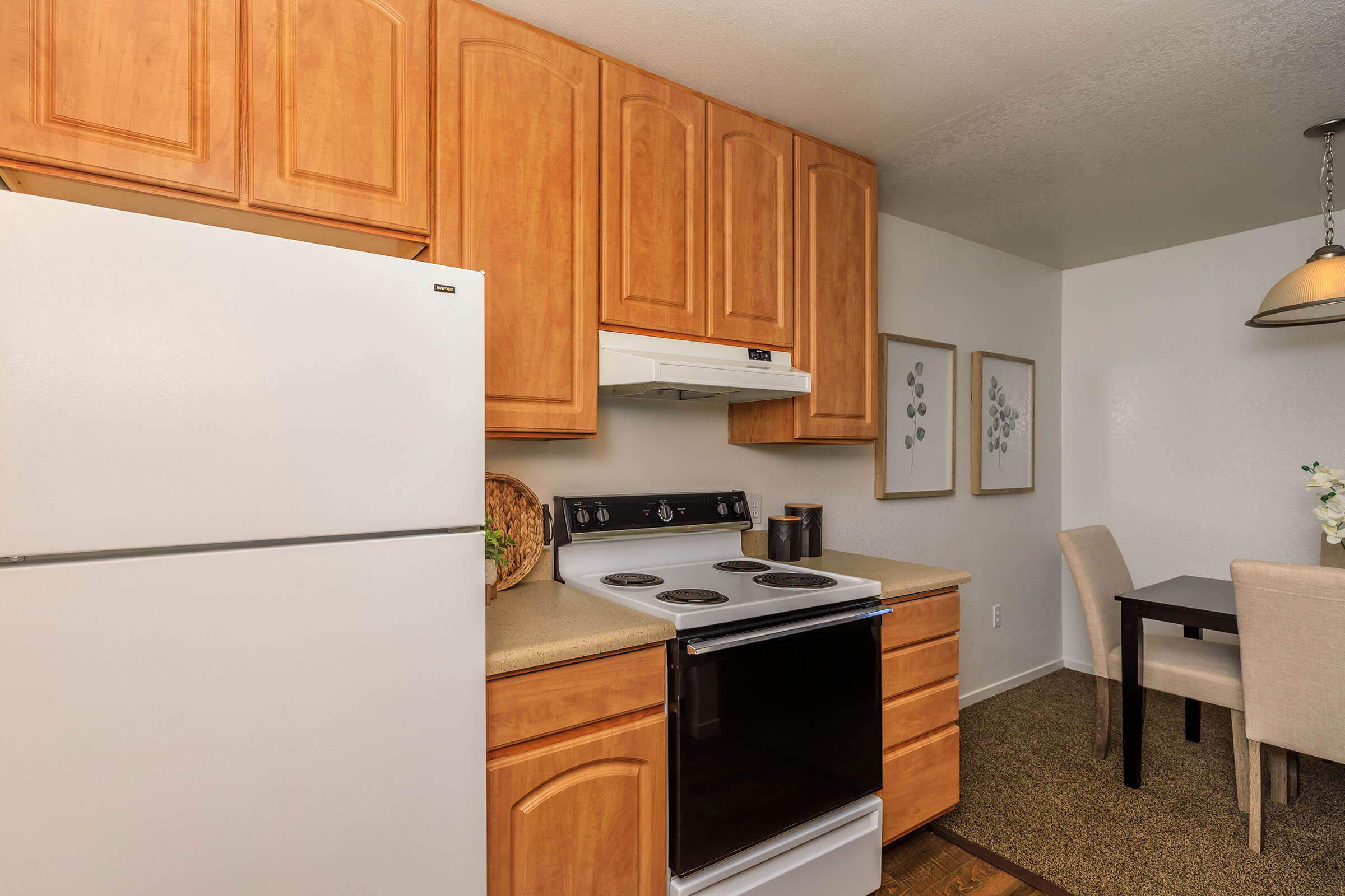 a kitchen with a stove top oven sitting inside of a refrigerator