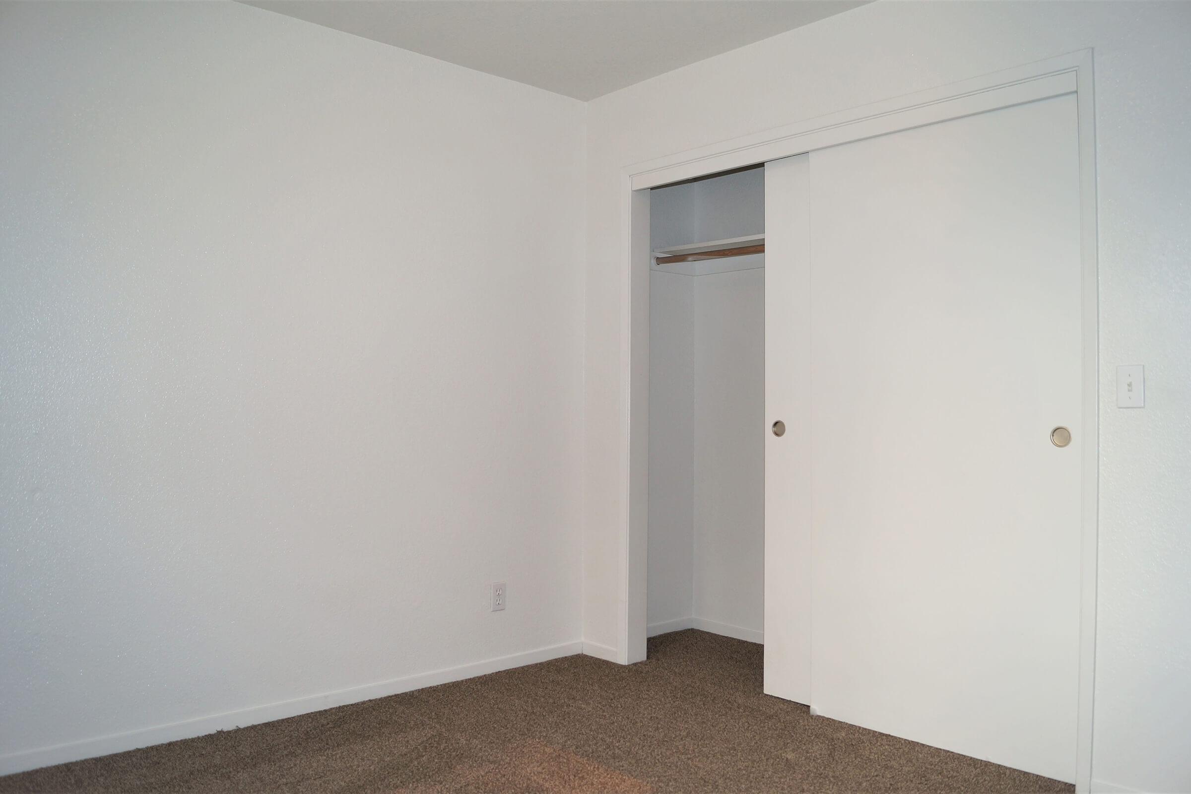 a white refrigerator freezer sitting in a room