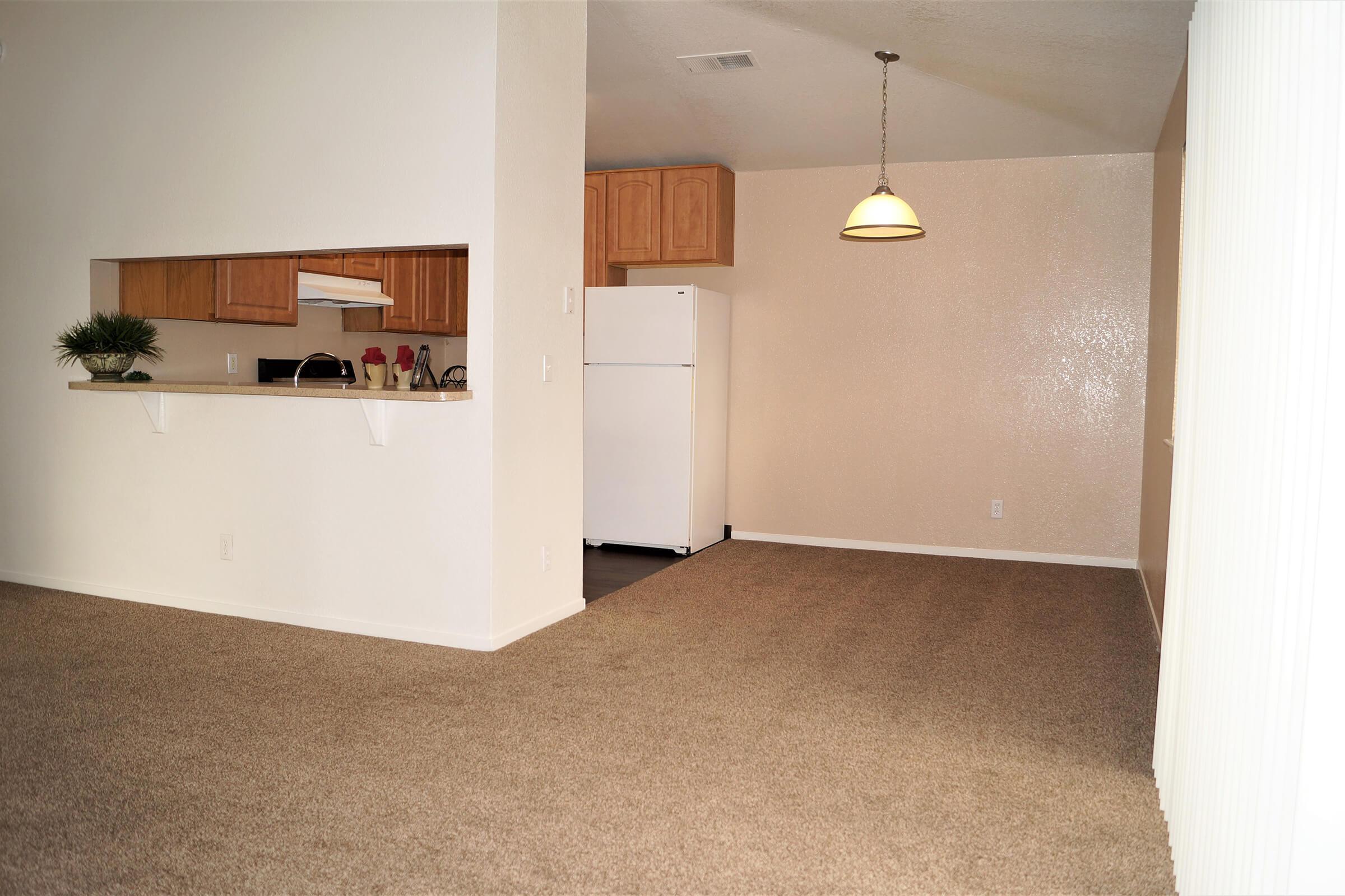 a white refrigerator freezer sitting in a room