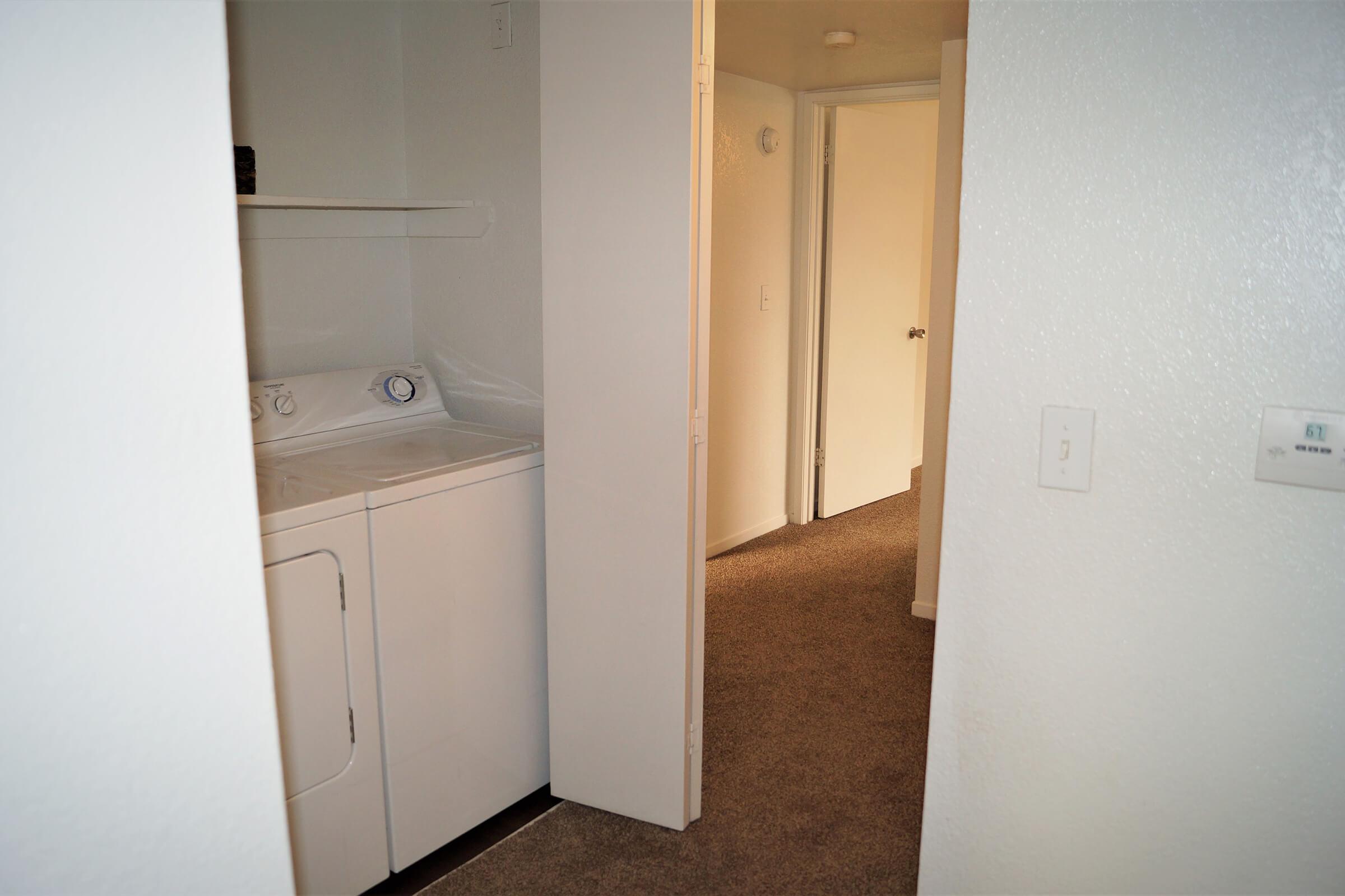 a white refrigerator freezer sitting in a room