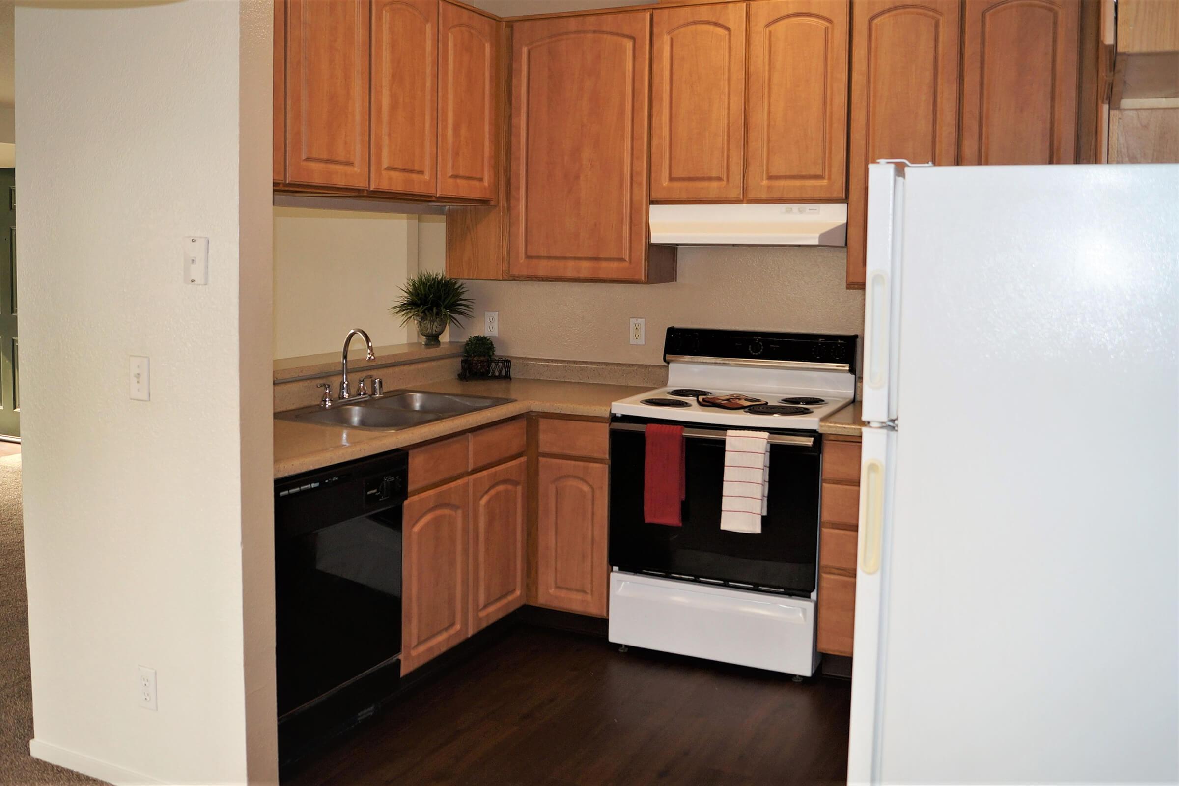 a kitchen with a stove top oven sitting inside of a refrigerator