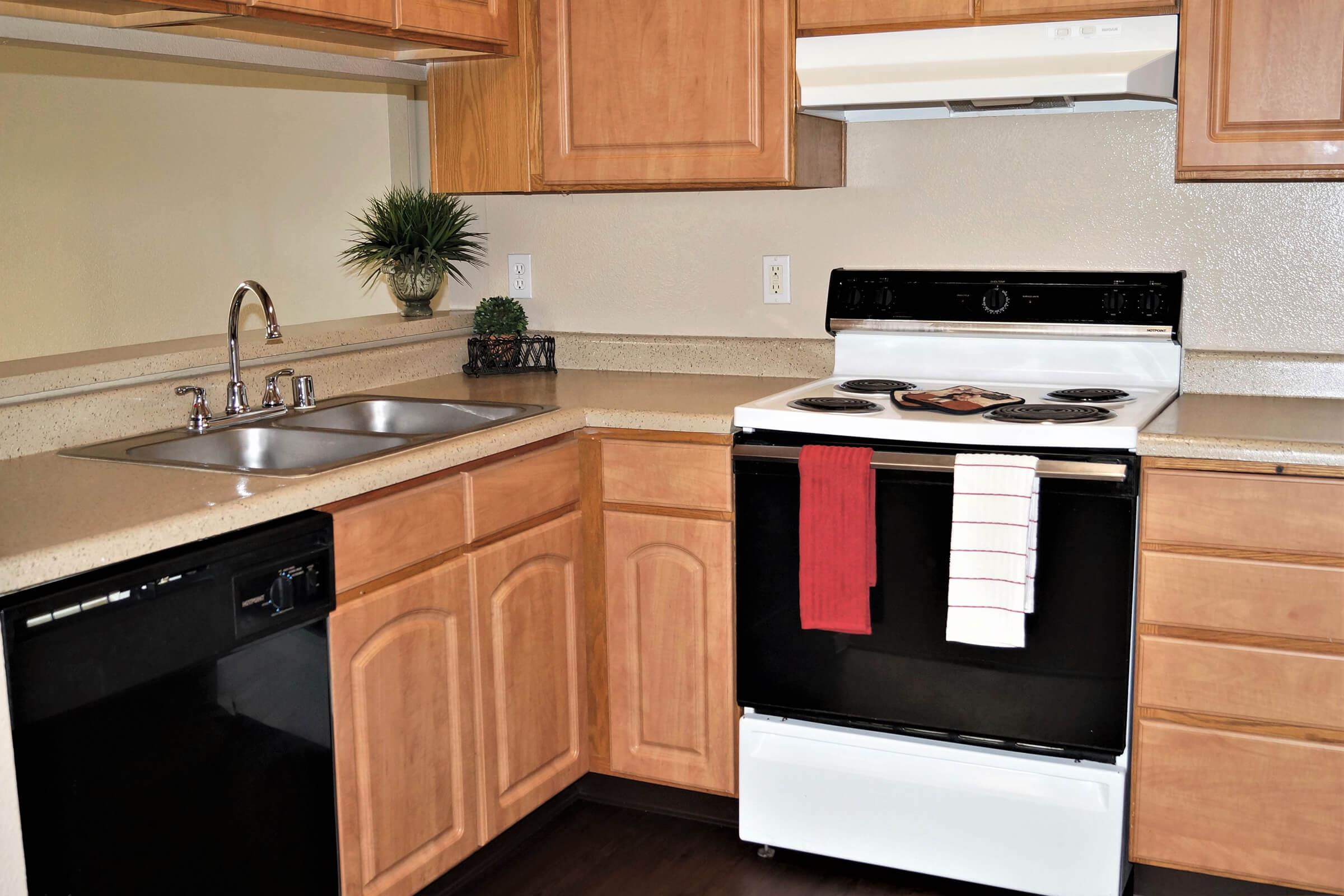 a stove top oven sitting inside of a kitchen