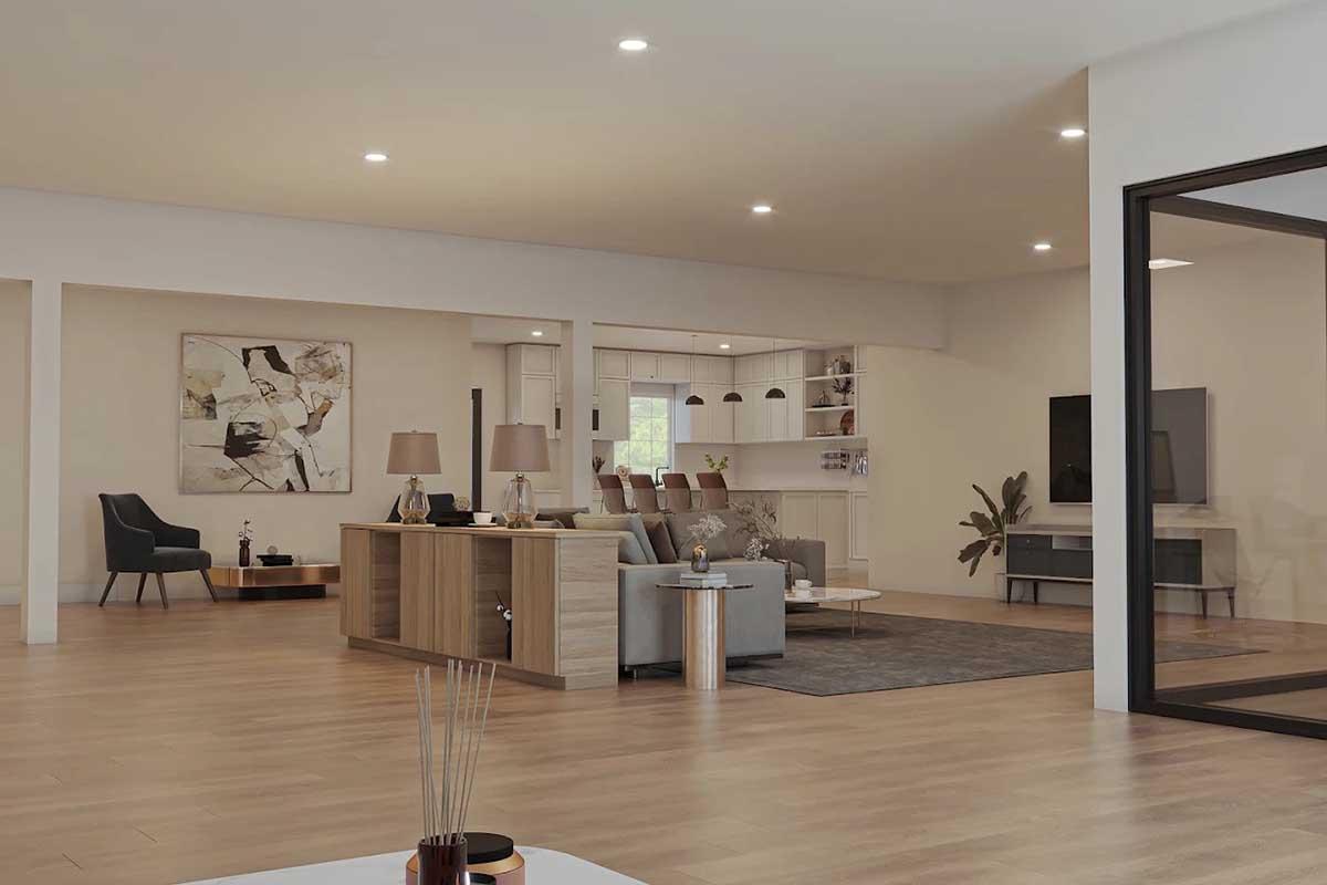 A modern living room featuring a light-colored sofa and chairs, a wooden coffee table, and a large TV mounted on the wall. Bright lighting and neutral decor create an open, inviting atmosphere. A contemporary artwork decorates one wall, and large windows provide natural light.