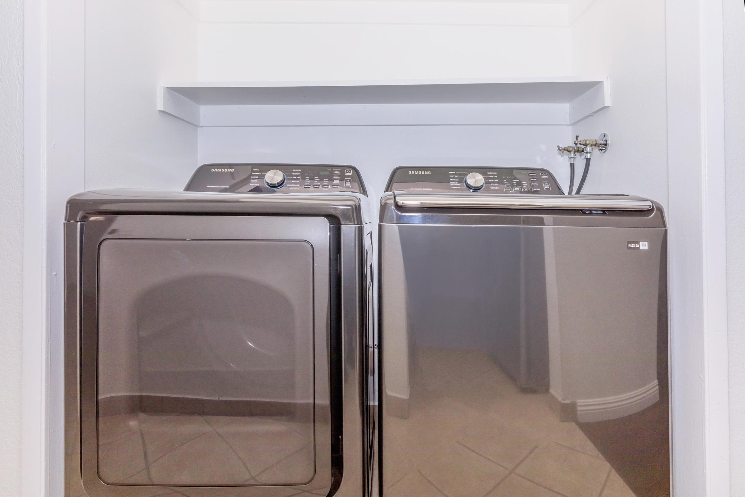 a microwave oven sitting on top of a refrigerator