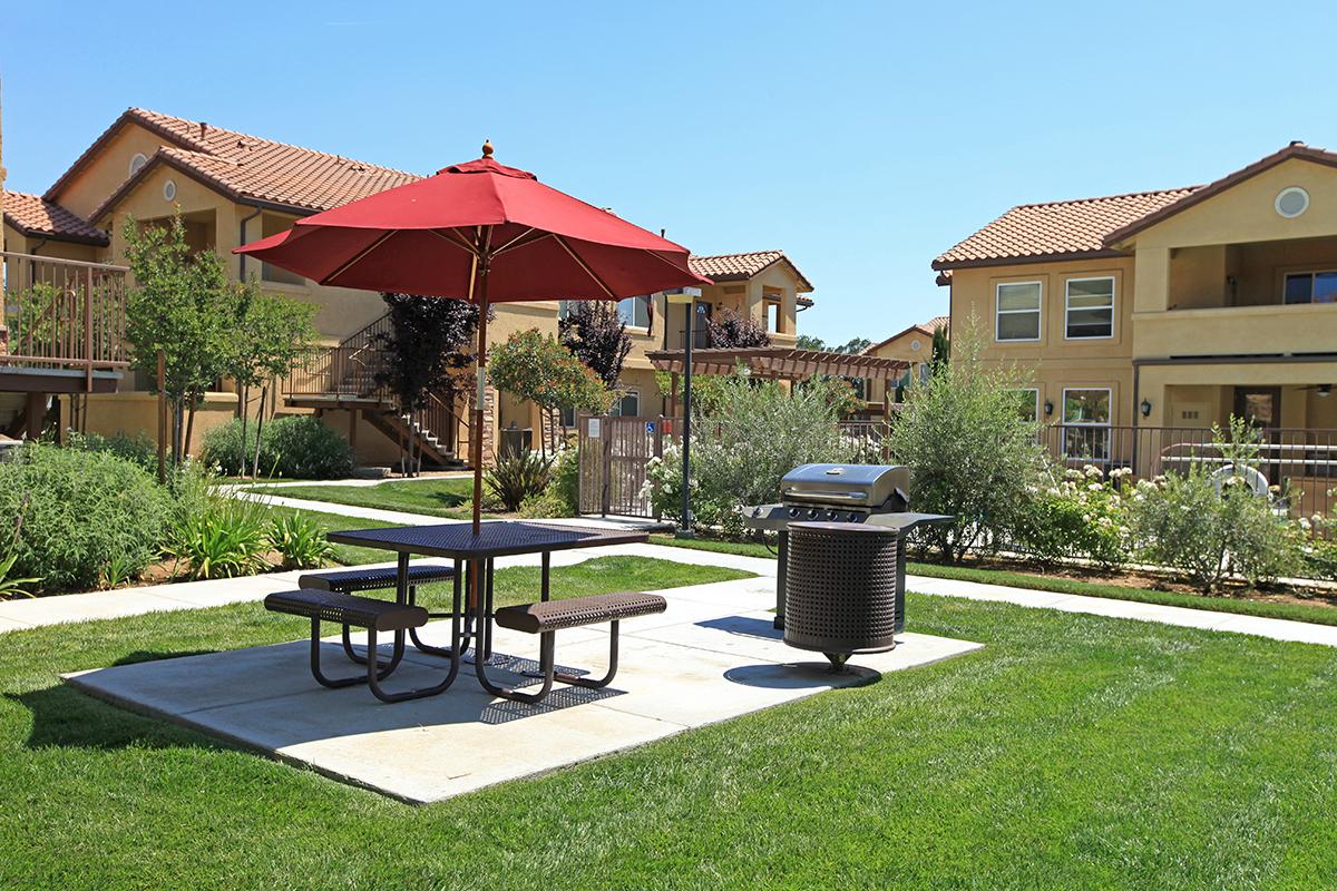 Enjoy the picnic area with barbecues at Villa Siena Apartments