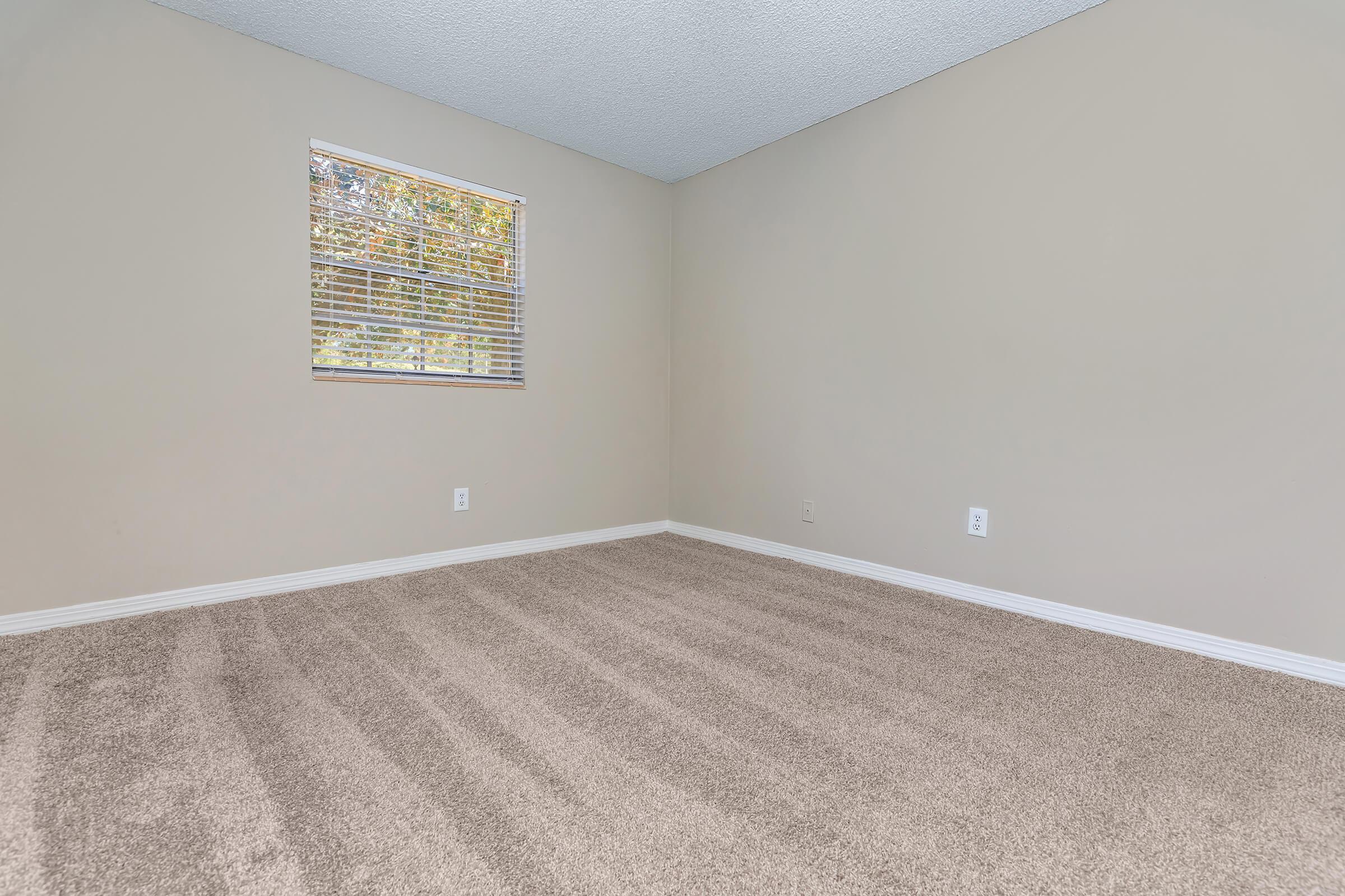 a bedroom with a large window
