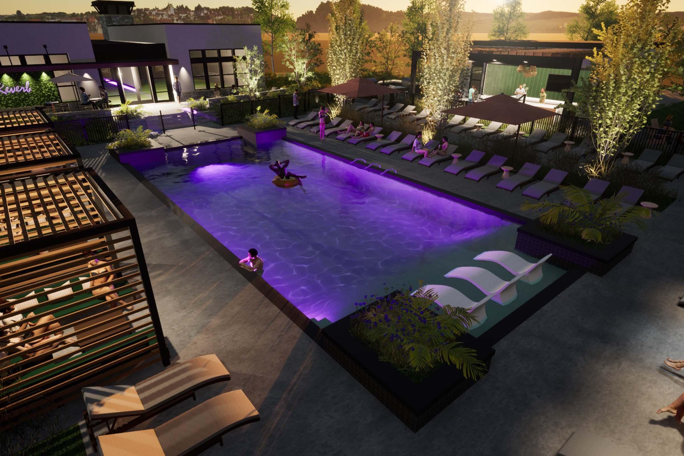 A modern outdoor pool area featuring a large pool illuminated with purple lighting, surrounded by lounge chairs and cabanas. Palm trees and greenery enhance the ambiance, with guests enjoying the space. The setting is tranquil, with a sunset glow in the background, creating a serene atmosphere.