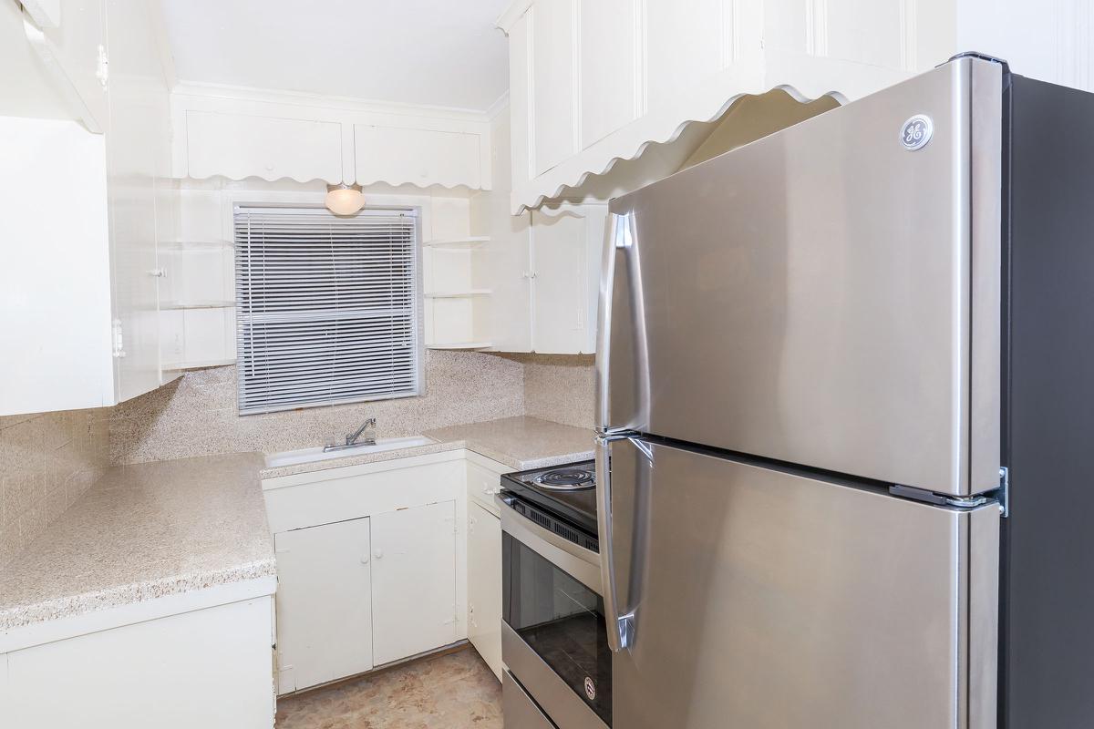 a stainless steel refrigerator in a kitchen