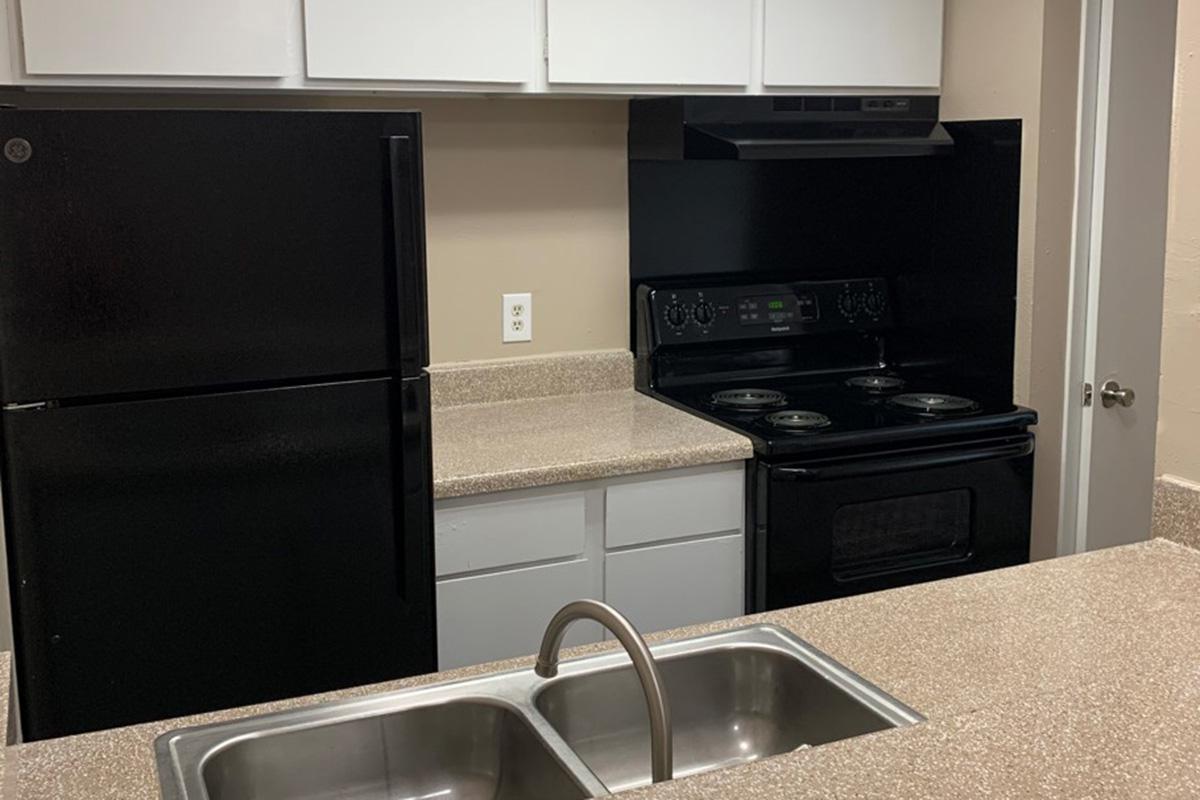 a kitchen with a sink and a microwave
