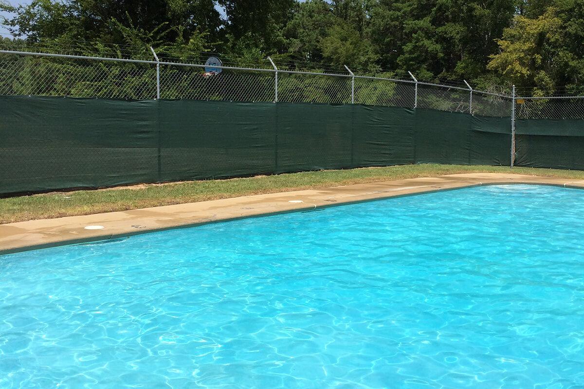 a pool next to a body of water