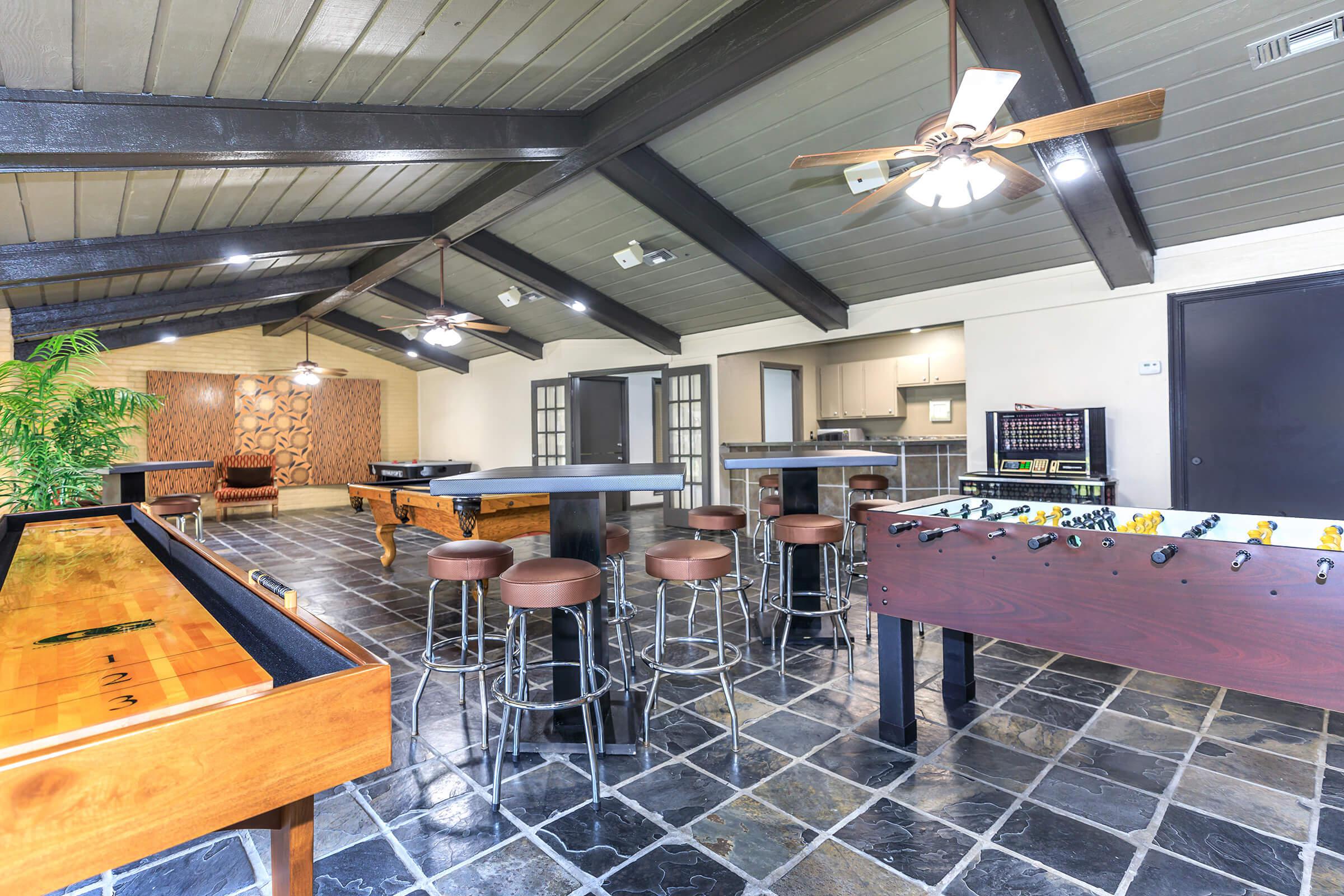 a kitchen with a table and chairs