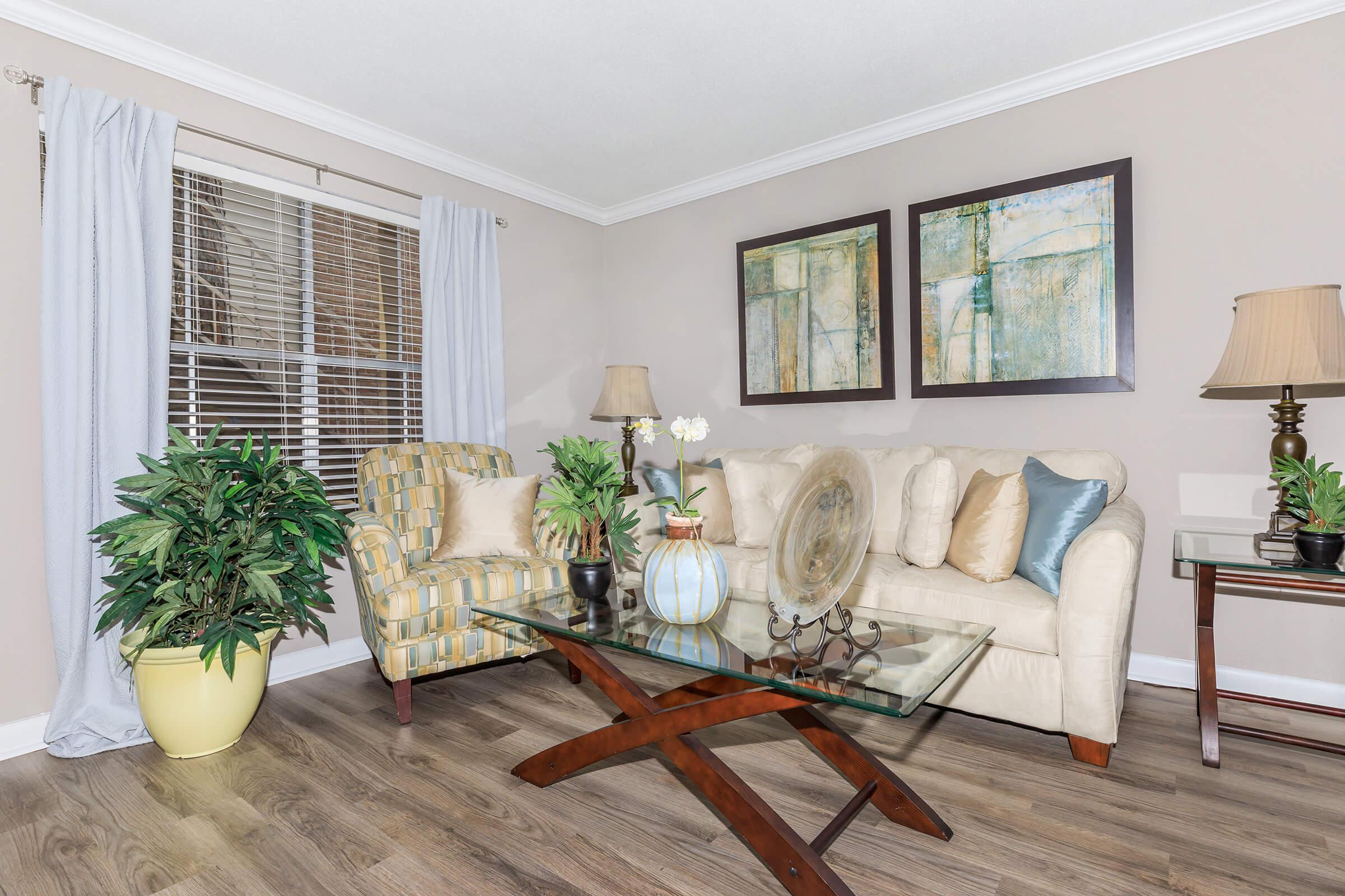 a living room filled with furniture and a fireplace