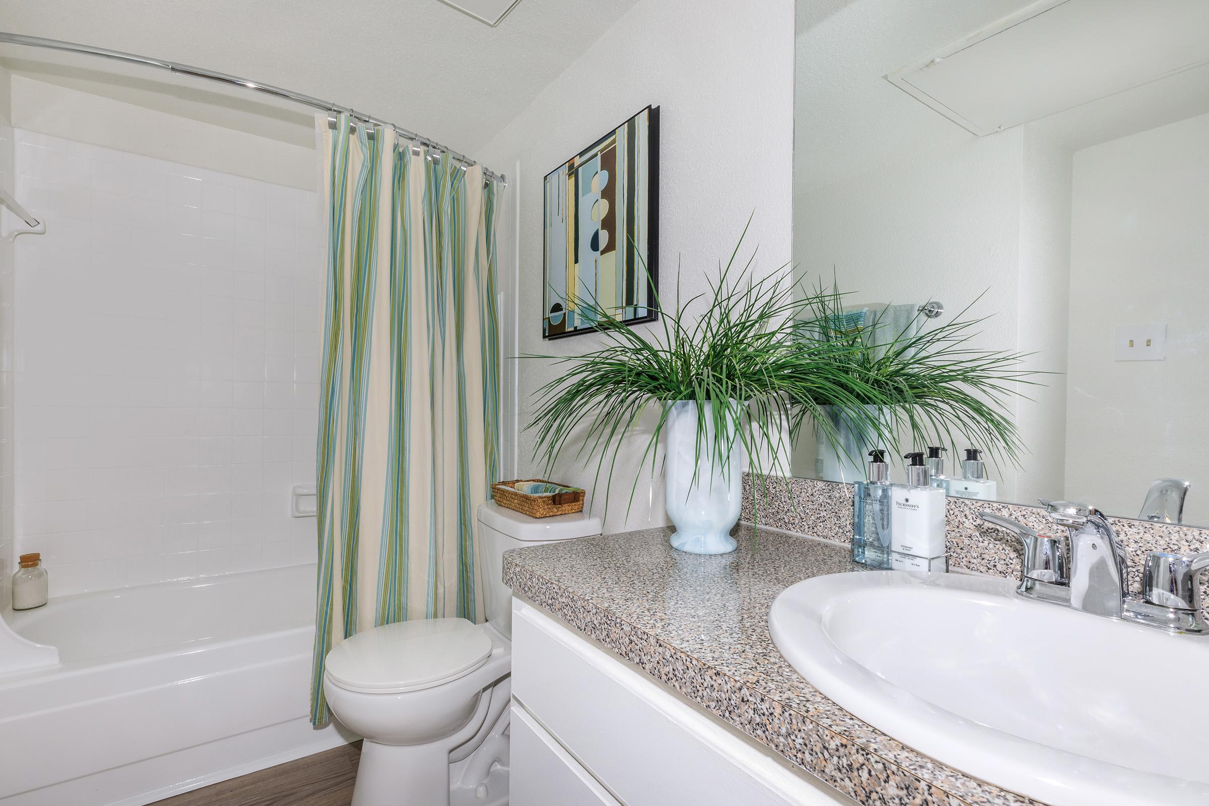 a room with a sink and a bath tub