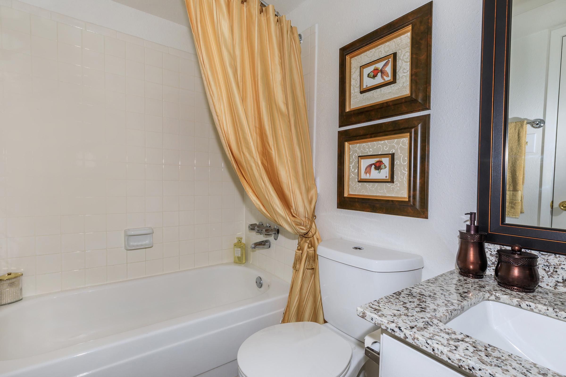 a room with a sink and a bath tub