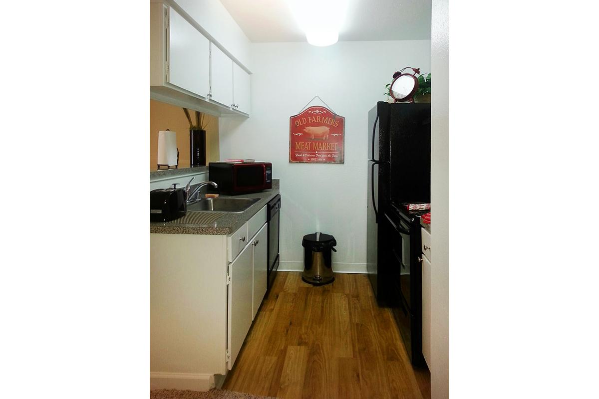 a kitchen with a stove and a refrigerator