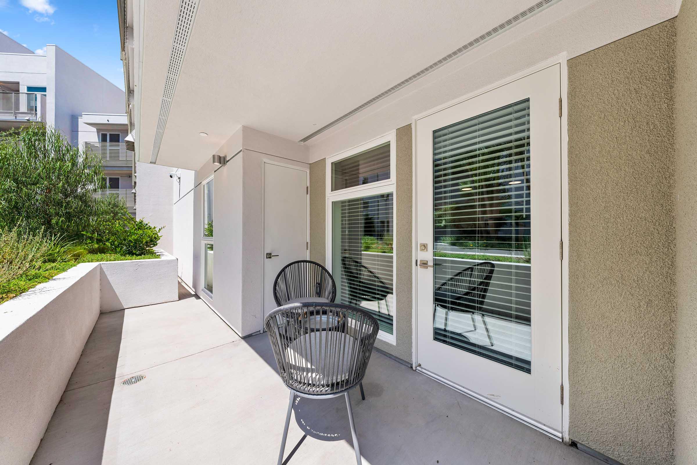 a patio with chairs