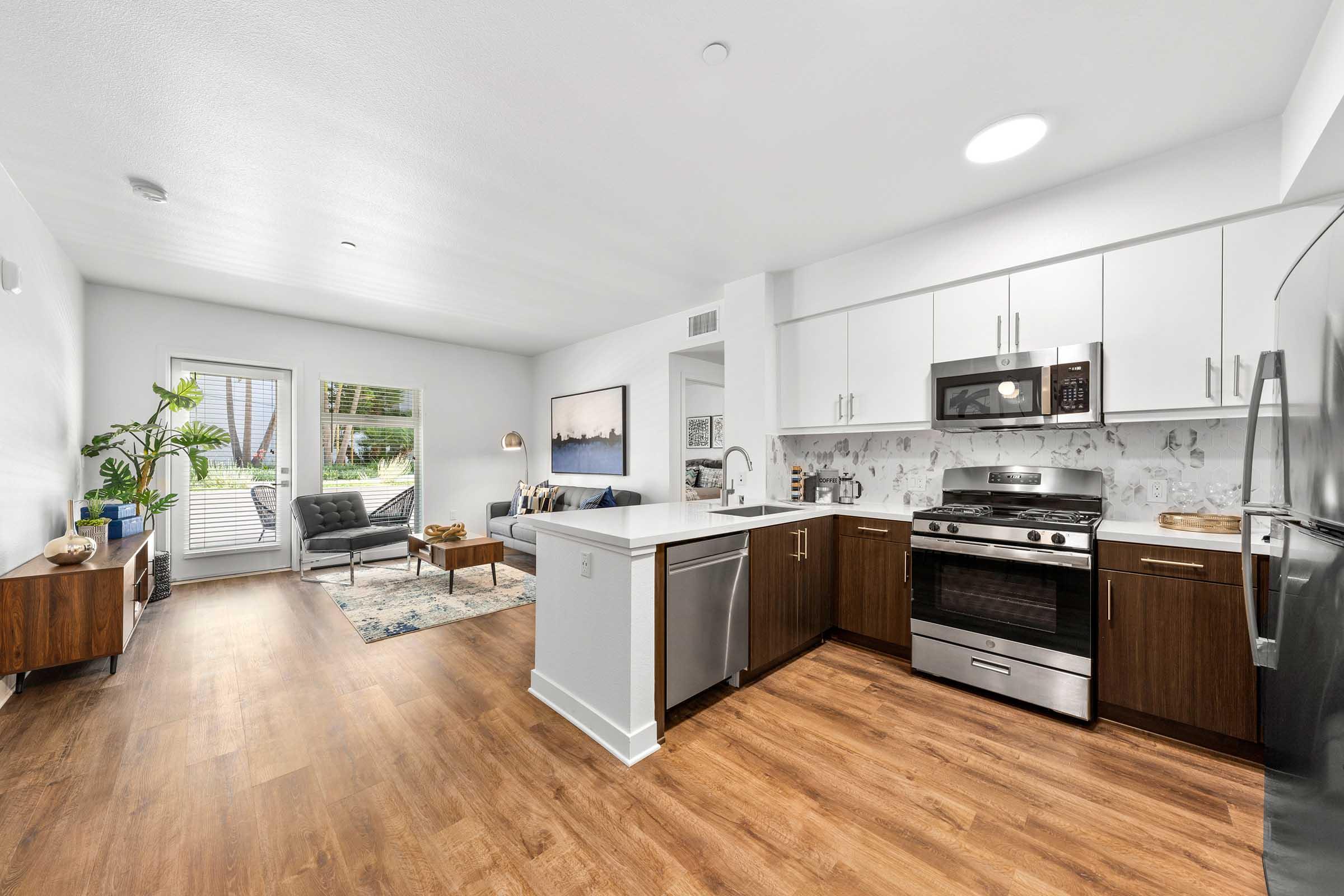 a kitchen with a wood floor