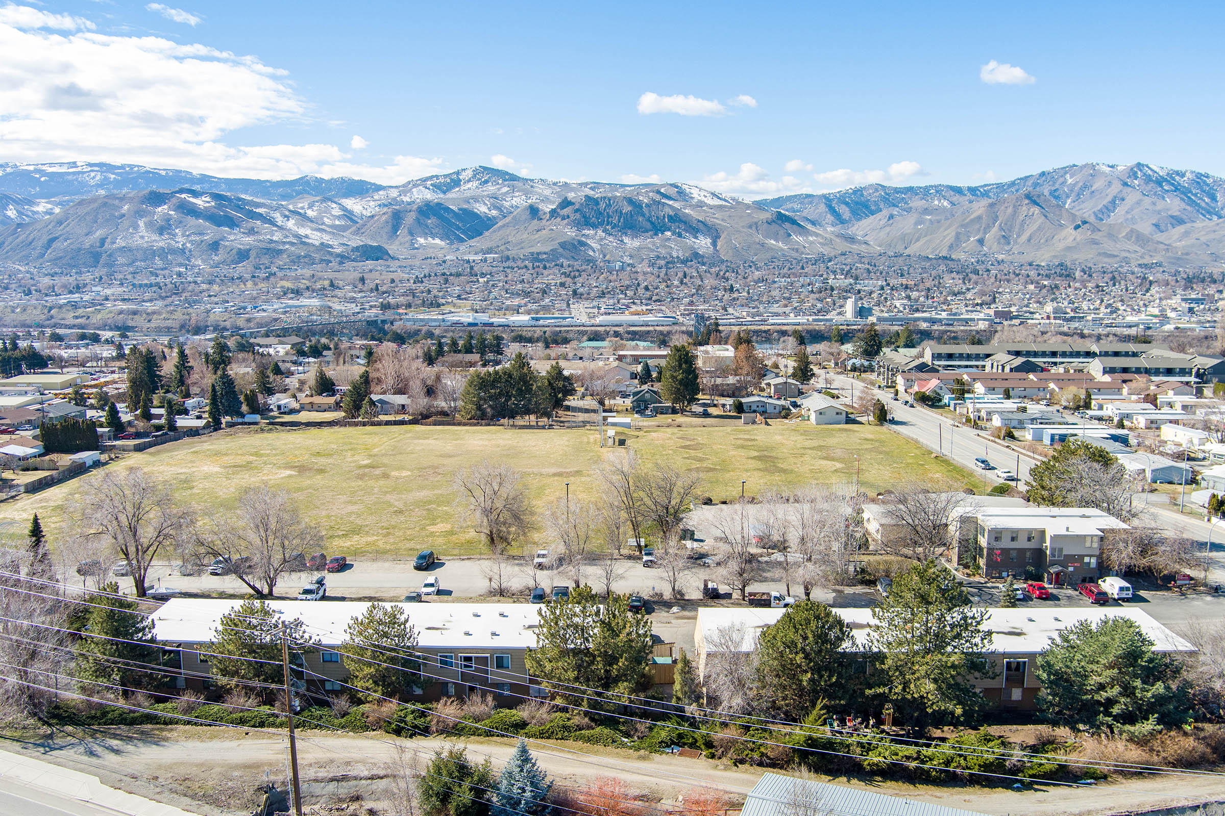 a view of a city with a mountain in the background