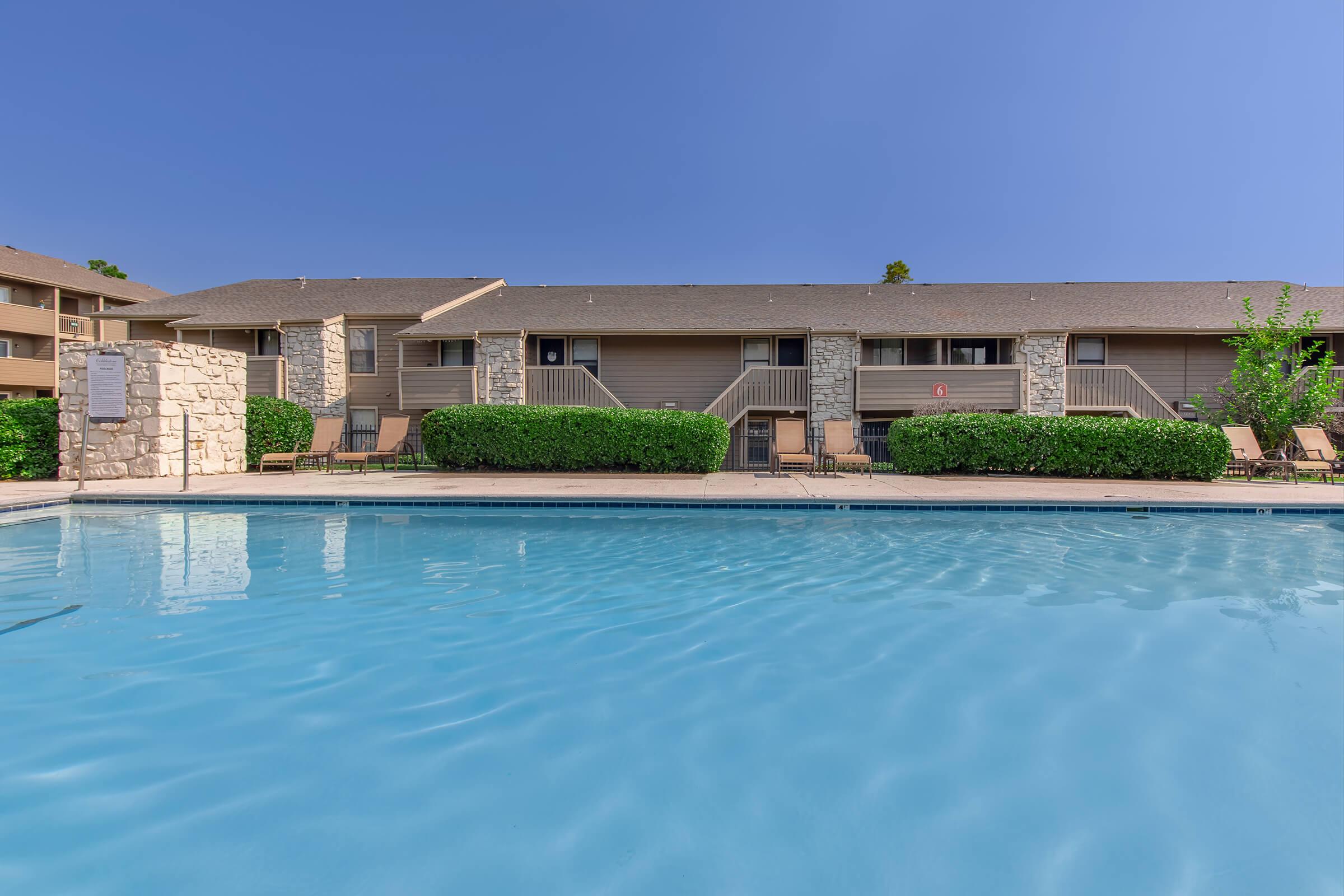 a house with a large pool of water