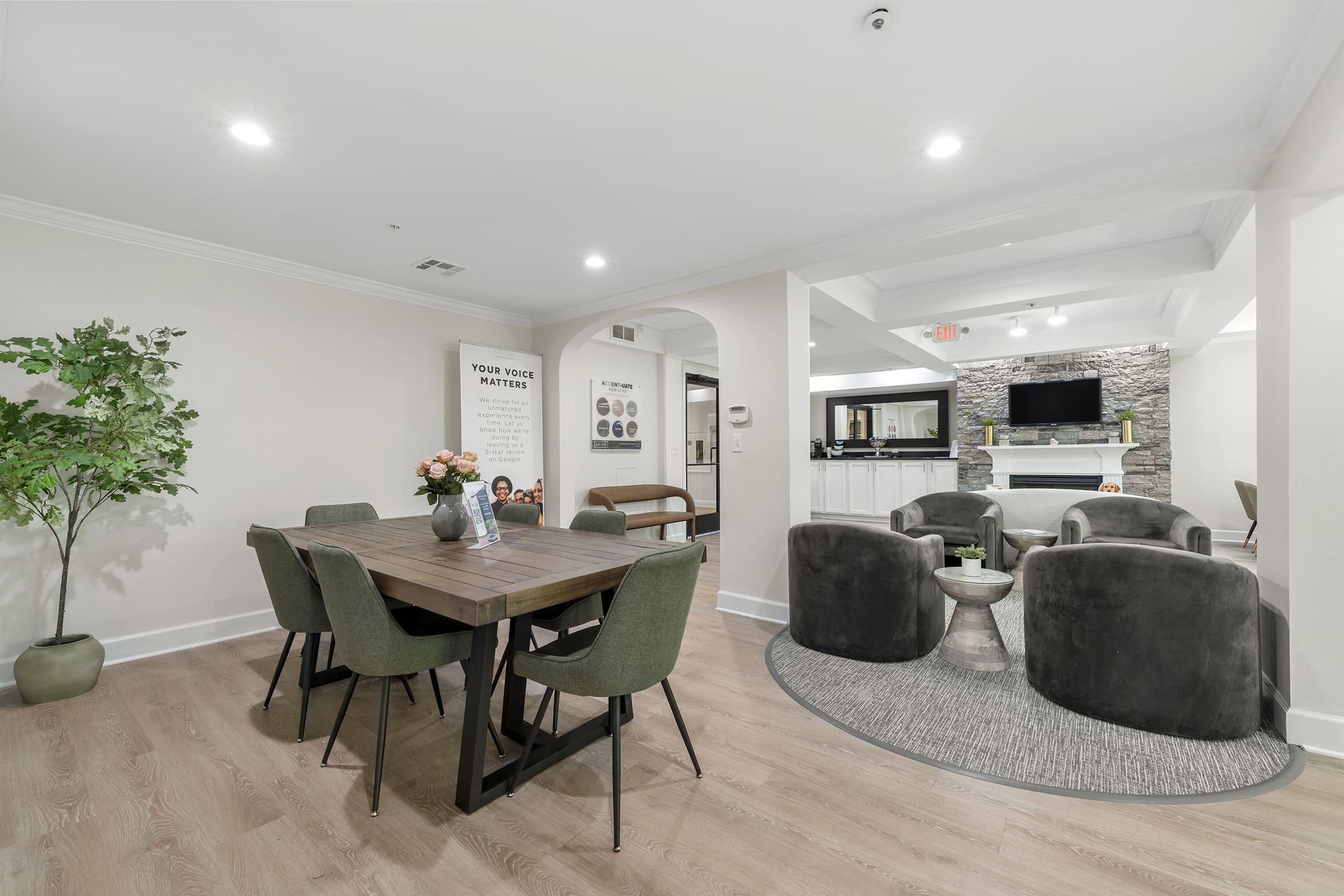 a living room filled with furniture and a table