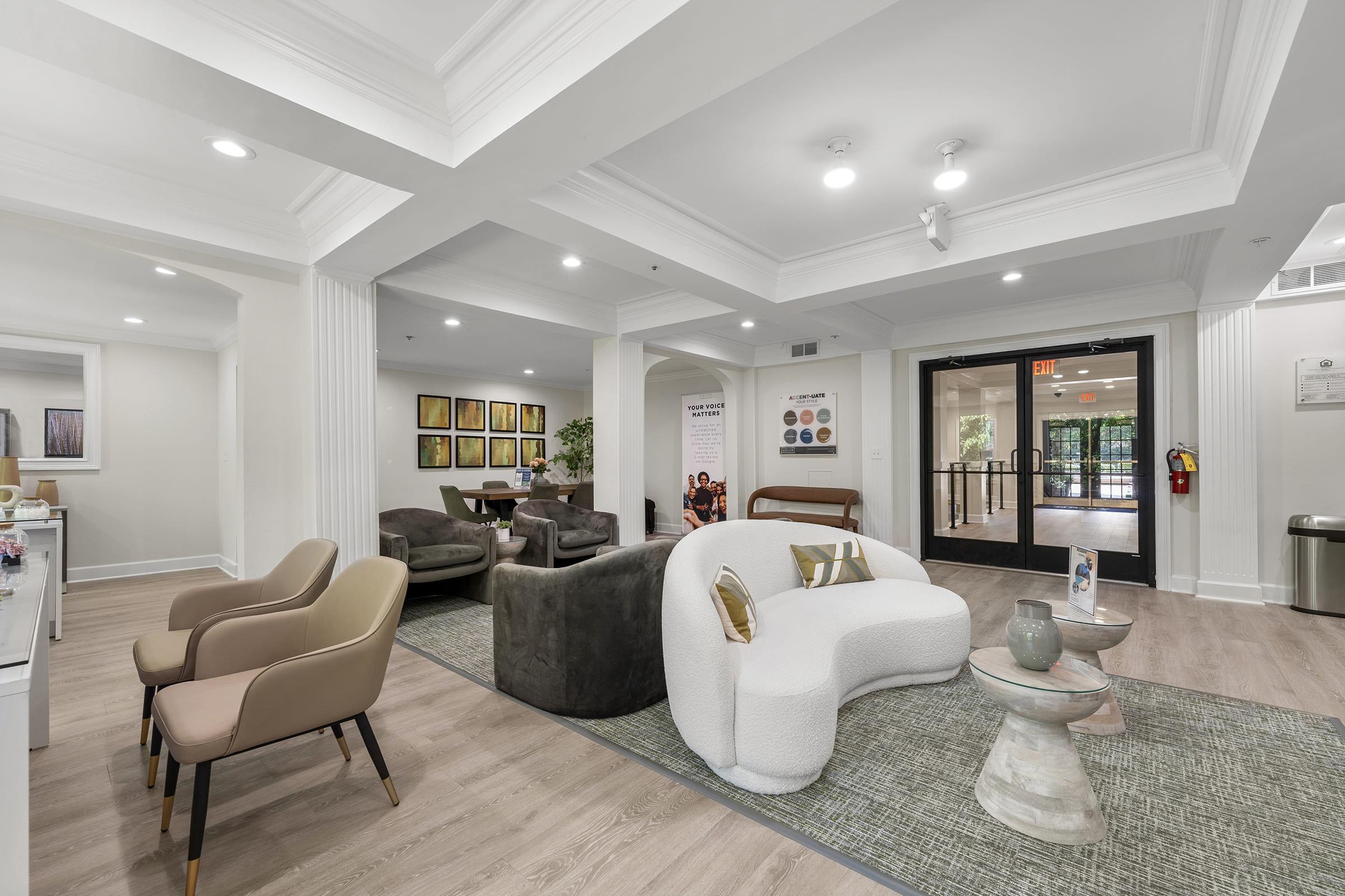 a living room filled with furniture and a large window