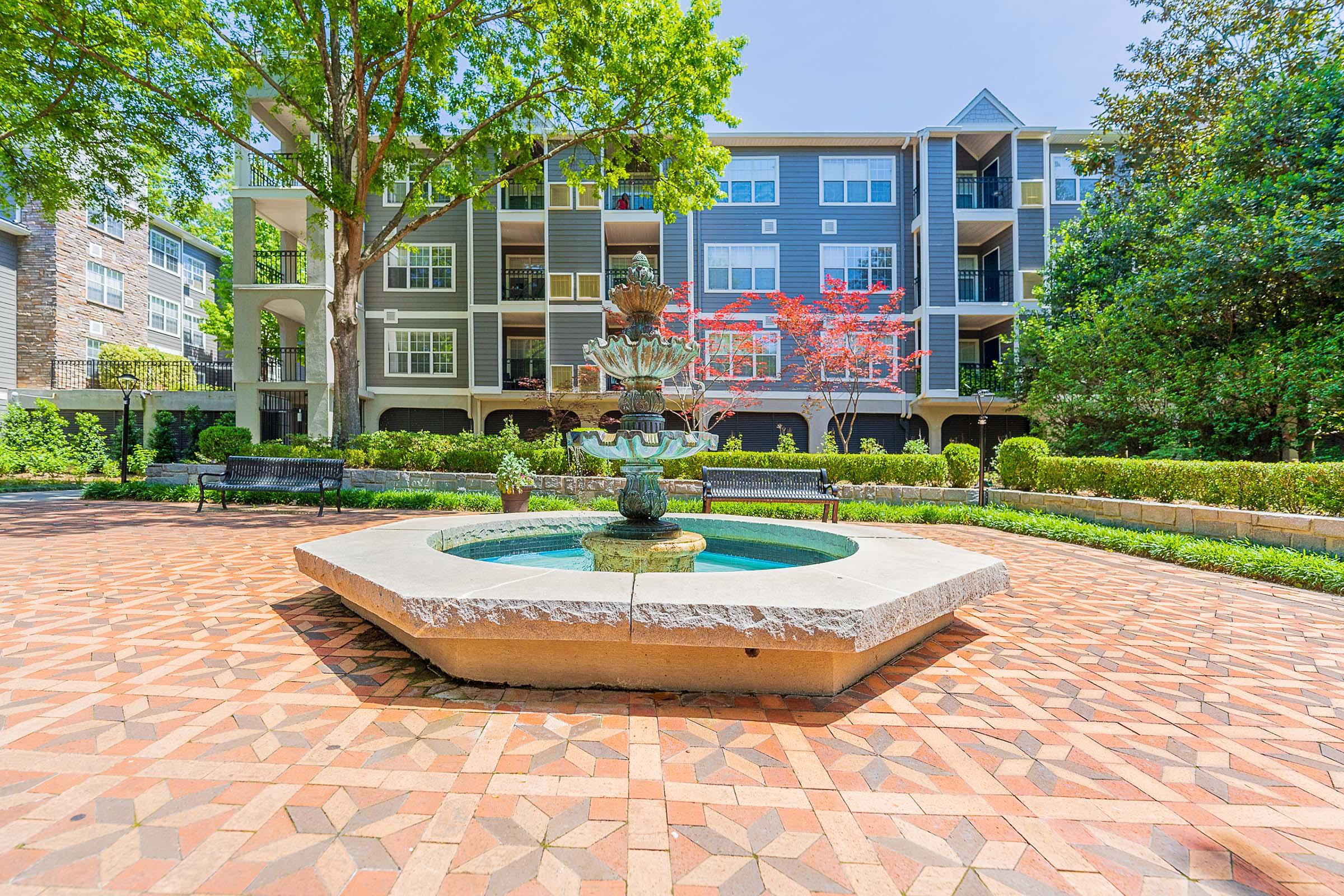 a bench in front of a brick building