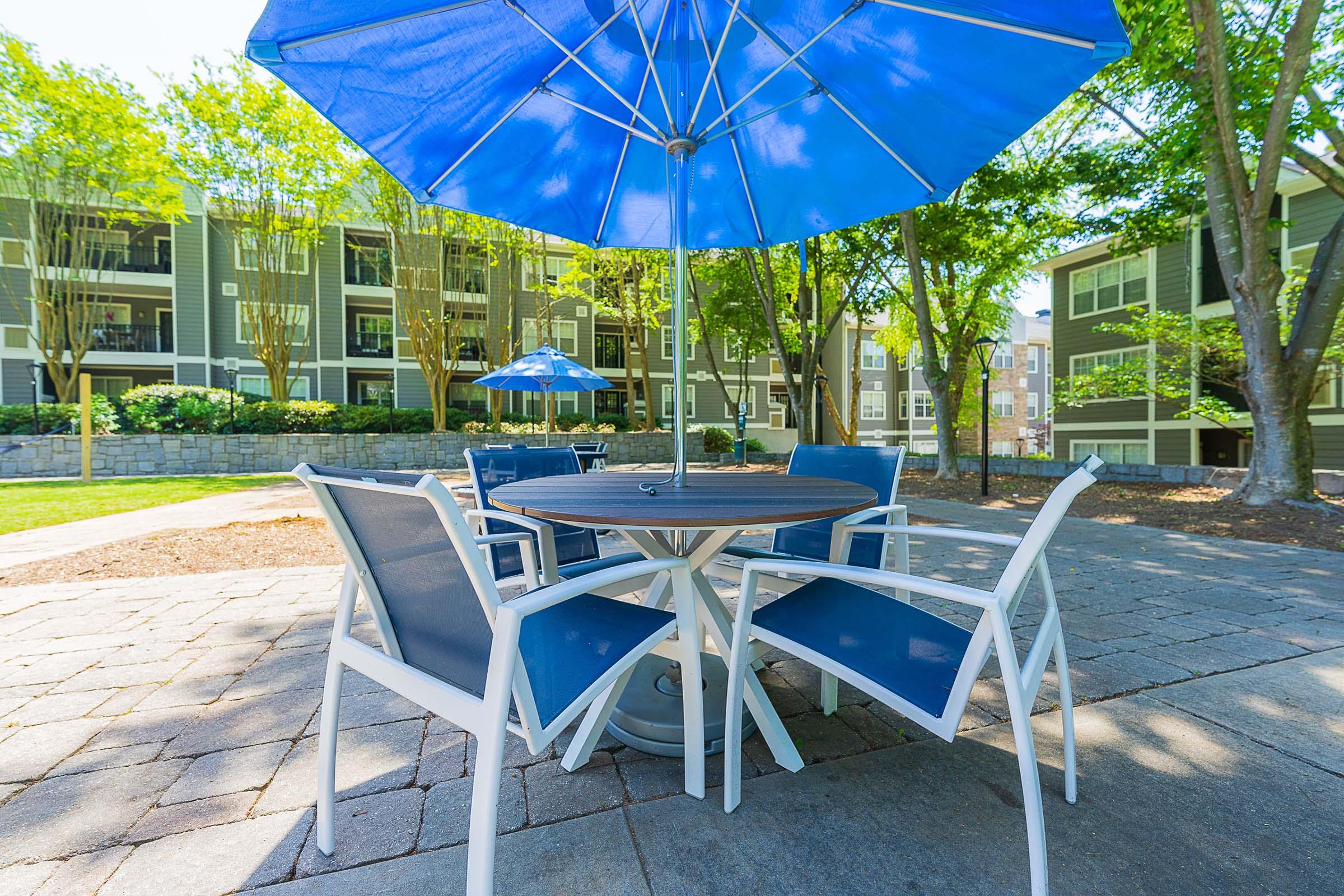 a lawn chair under an umbrella