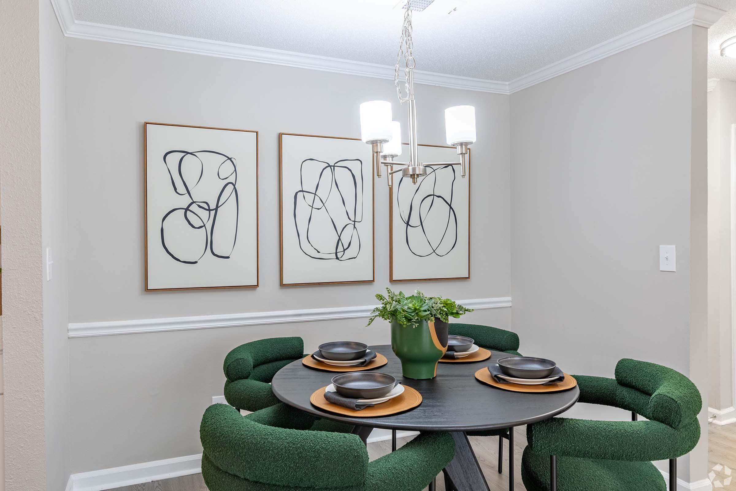 a room filled with furniture and vase of flowers on a table