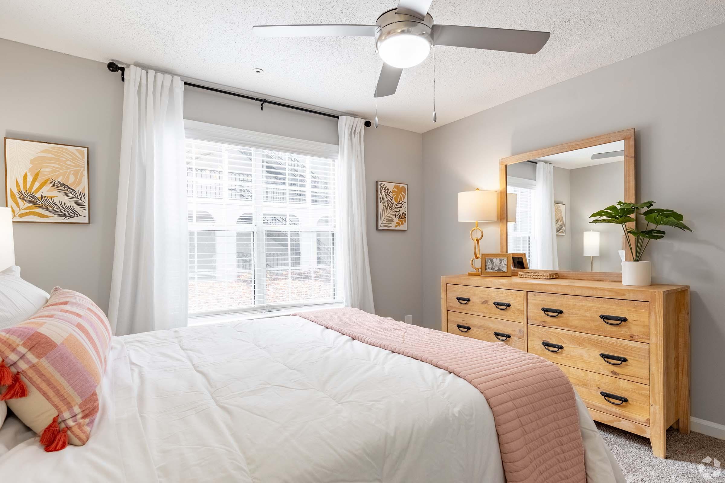 a bedroom with a large bed sitting in a room