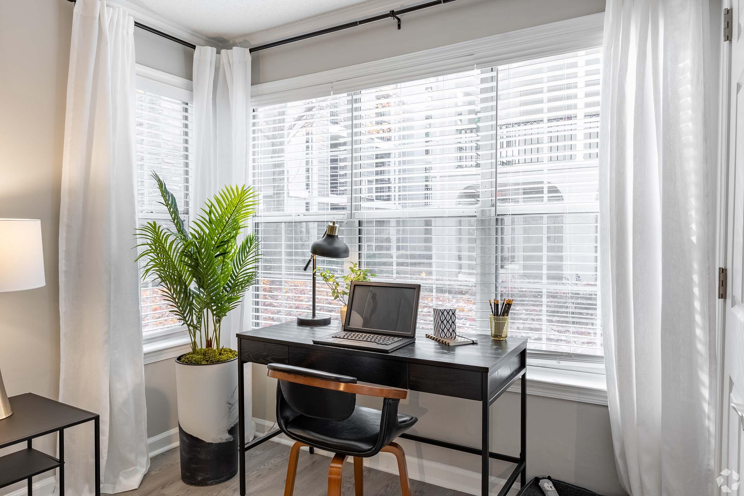 a chair sitting in front of a window