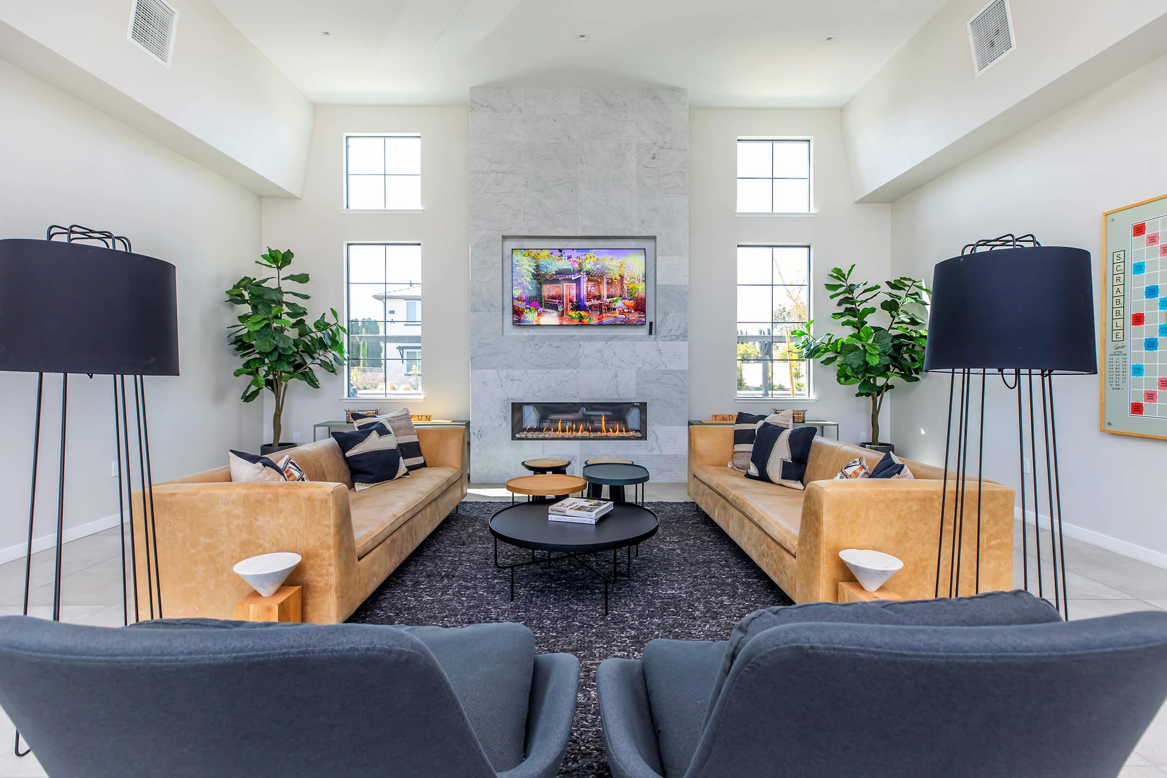 a living room filled with furniture and a fireplace