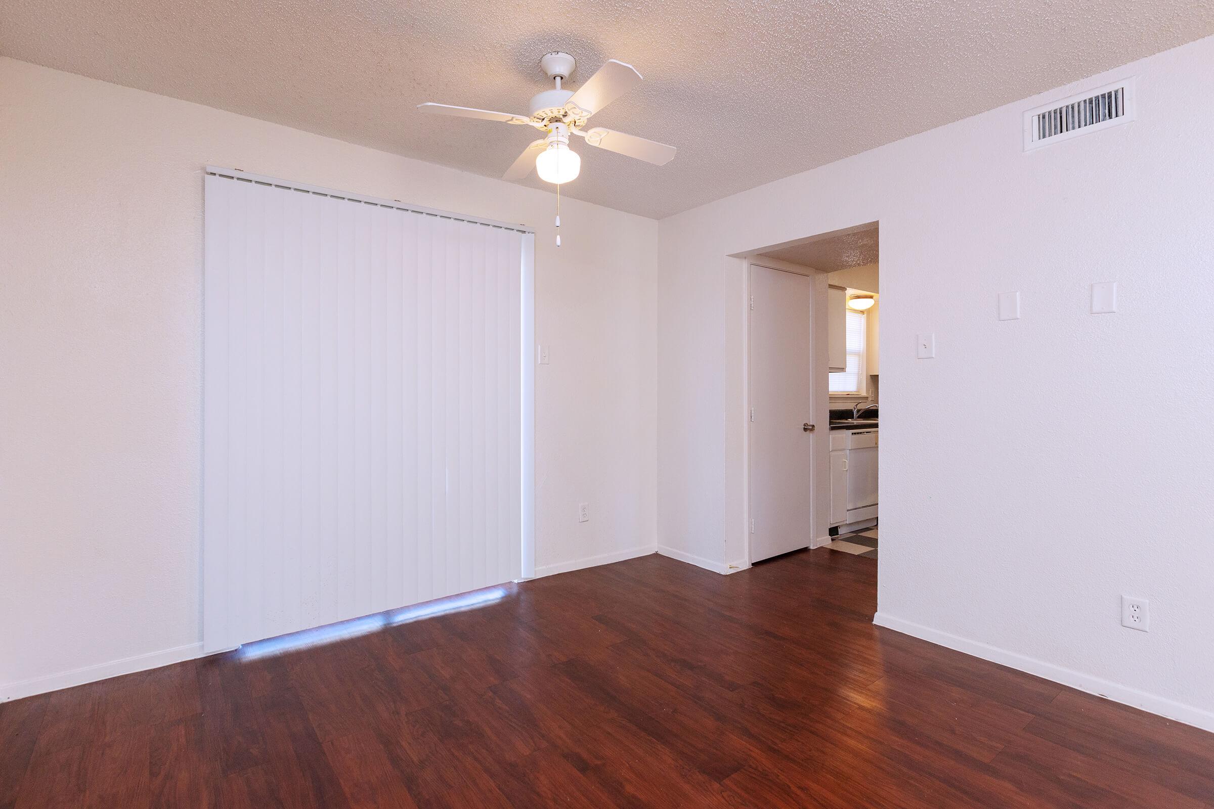 a large empty room with a wooden floor