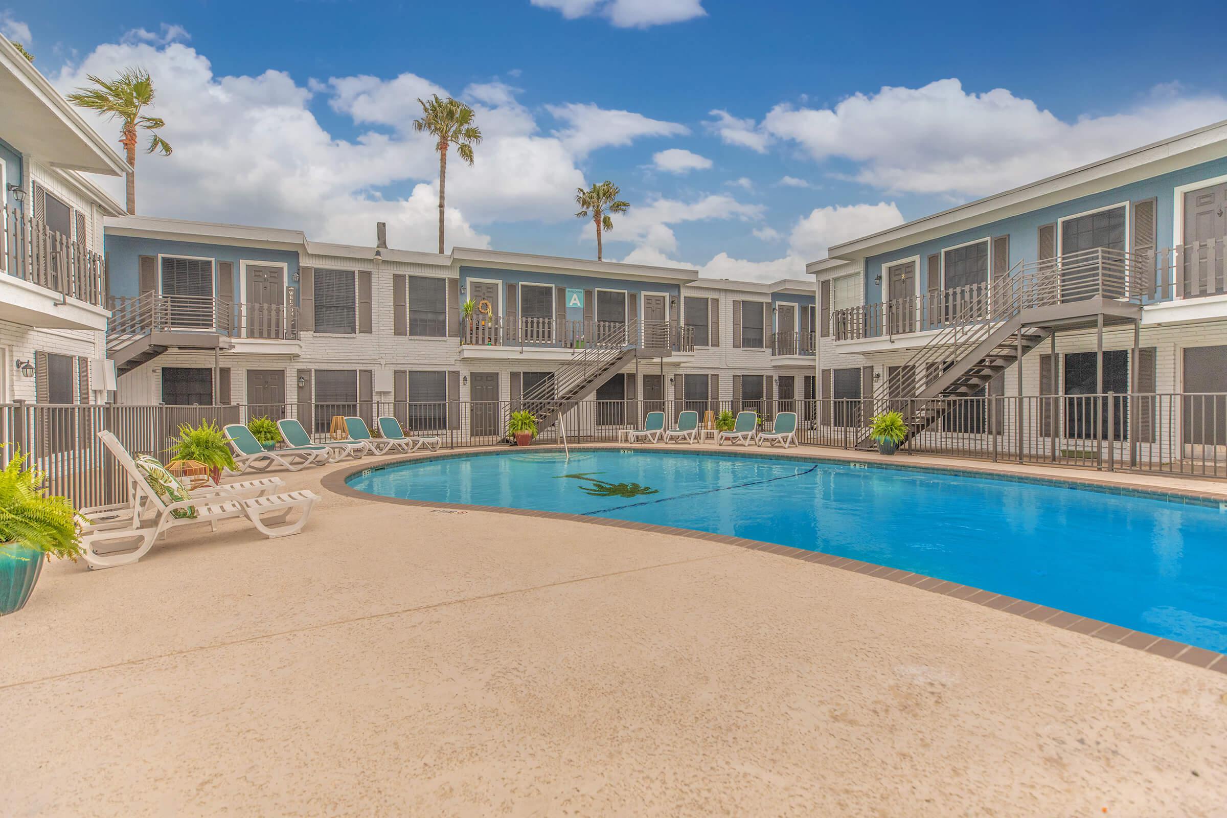 a large pool of water in front of a building